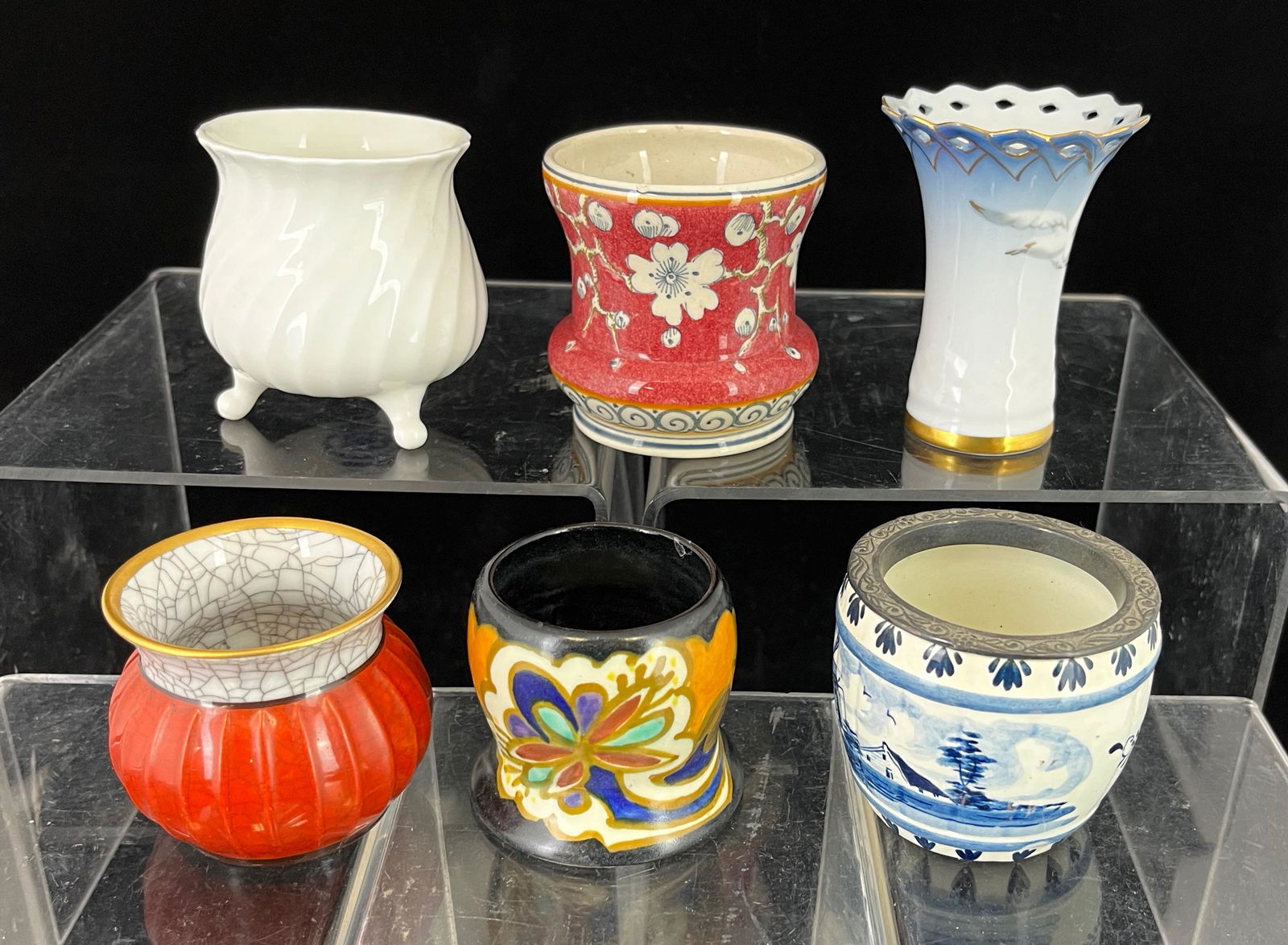 Six Northern European toothpicks: Six Northern European porcelain toothpick holders including three marked Gouda, one Royal Copenhagen, one Delfts, and one Bing & Grondahl; tallest 3". CONDITION: small flake on inside rim of cobalt Go