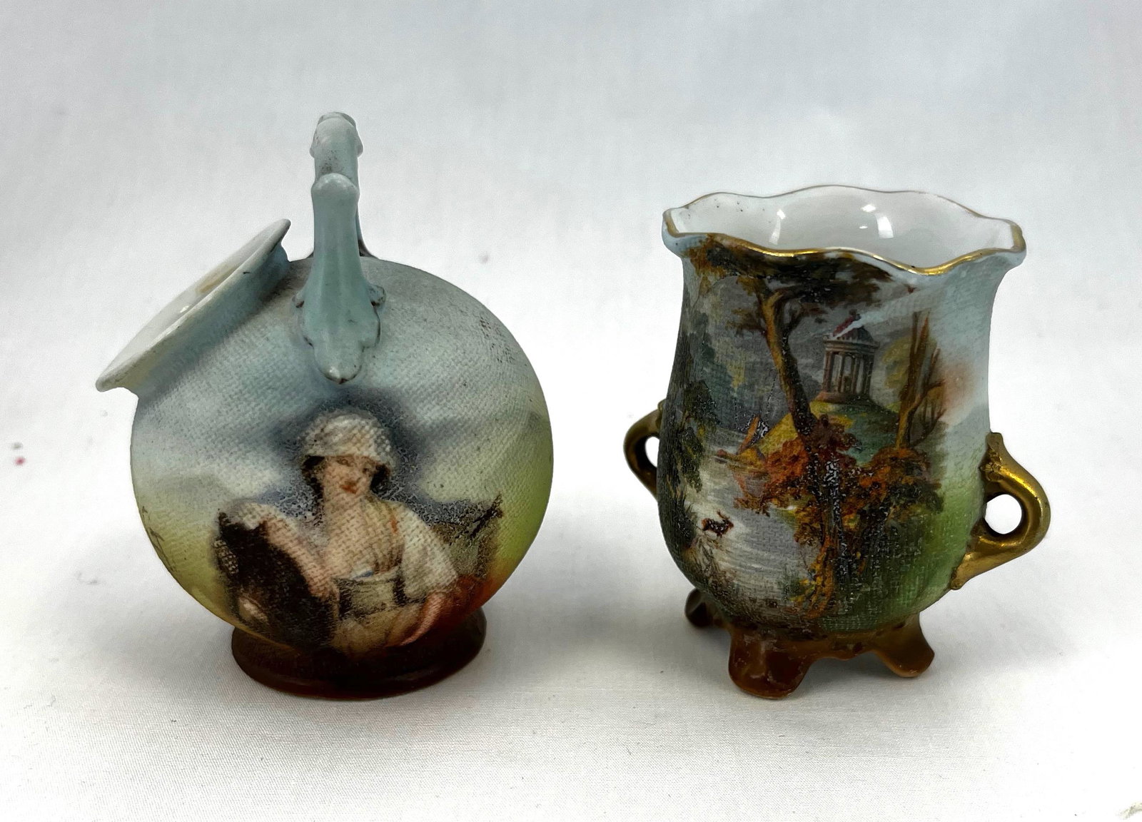 Two Royal Bayreuth toothpicks: Two Royal Bayreuth Tapestry toothpick holders, one portrait and one with forest scene; 2.5". CONDITION: no defects noted.