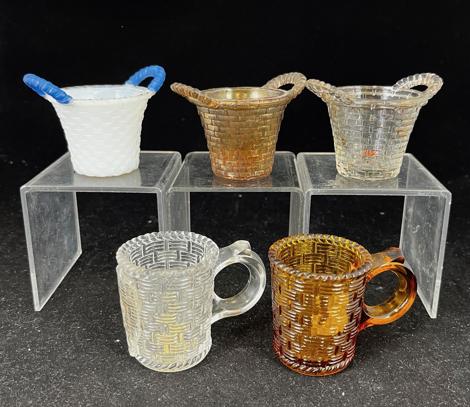 Five EAPG basket motif toothpicks: Five EAPG basket motif toothpick holders including Happy Thought, various makers, three with gold dŽcor; tallest 2 1/4". CONDITION: good with minor wear.