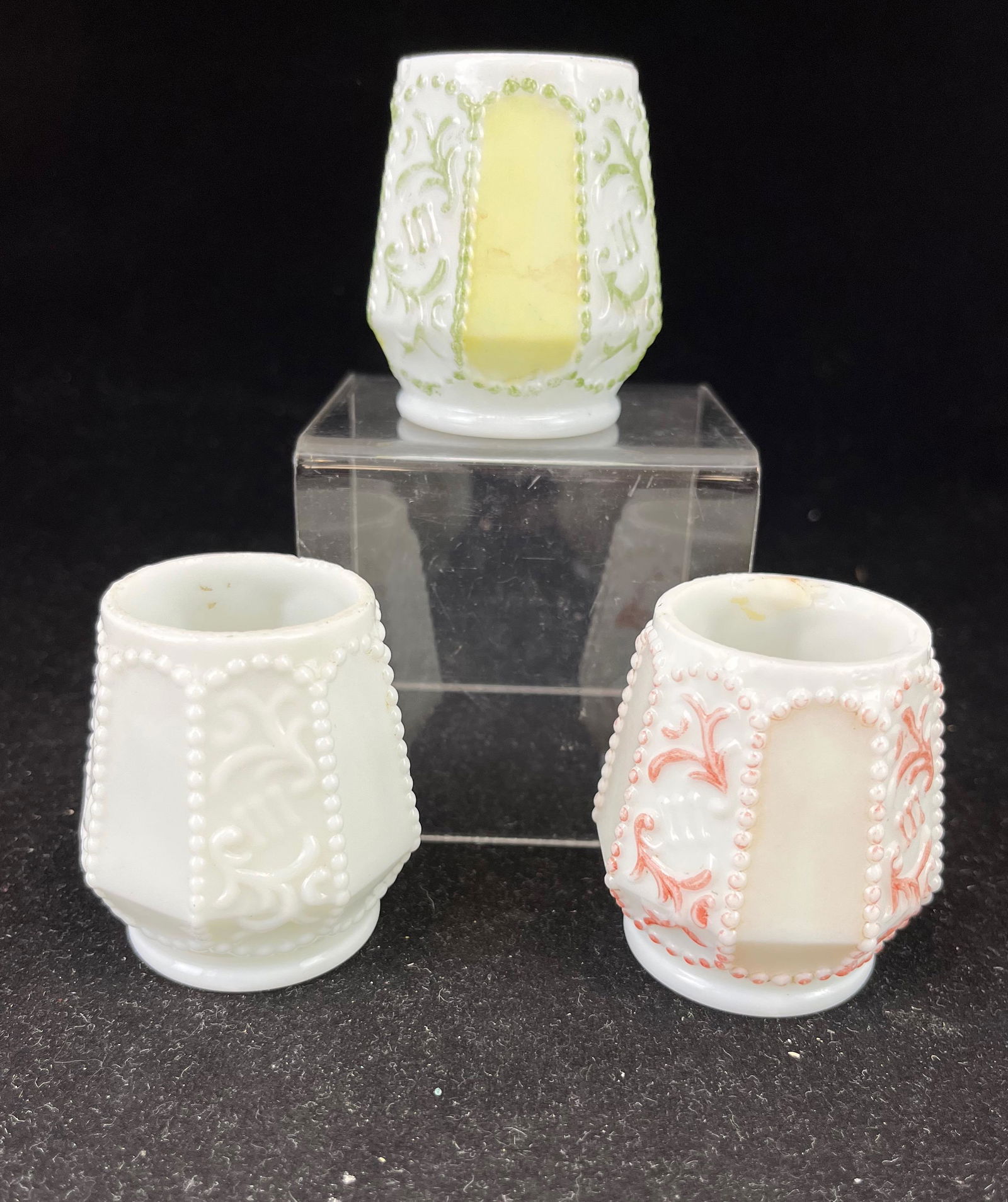 Three Fostoria Draped Beads toothpicks: Three Fostoria Draped Beads toothpick holder including opal with pink, opal with green, and a milk glass; 2 3/8" ht. CONDITION: good with some roughness to top of all.