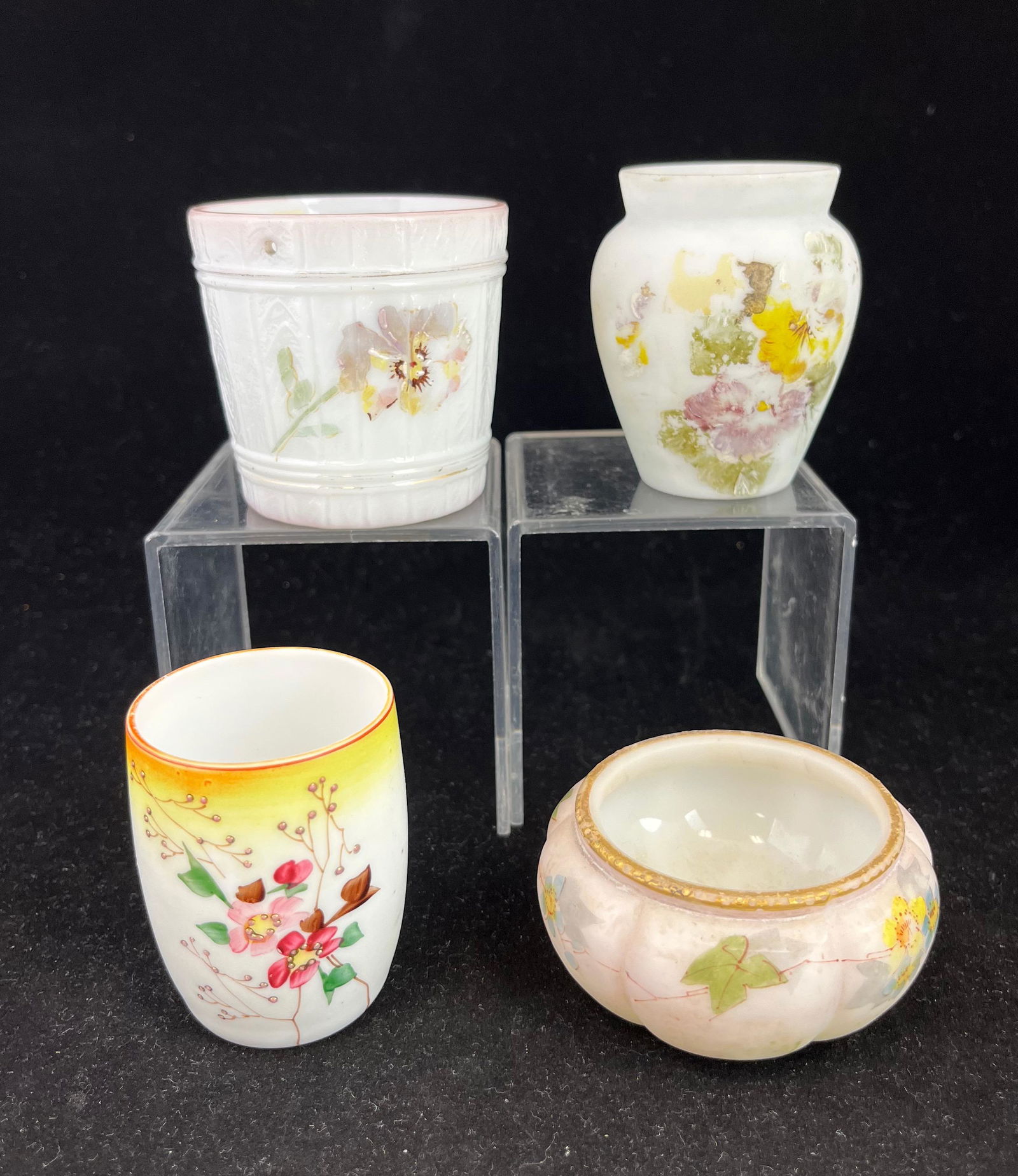 Mt. Washington toothpick holders: Four Mt. Washington toothpick holders, each in opaline decorated with flowers; tallest 2 3/4". CONDITION: dots missing on melon ribbed Smith Bros, otherwise good with minor issues.