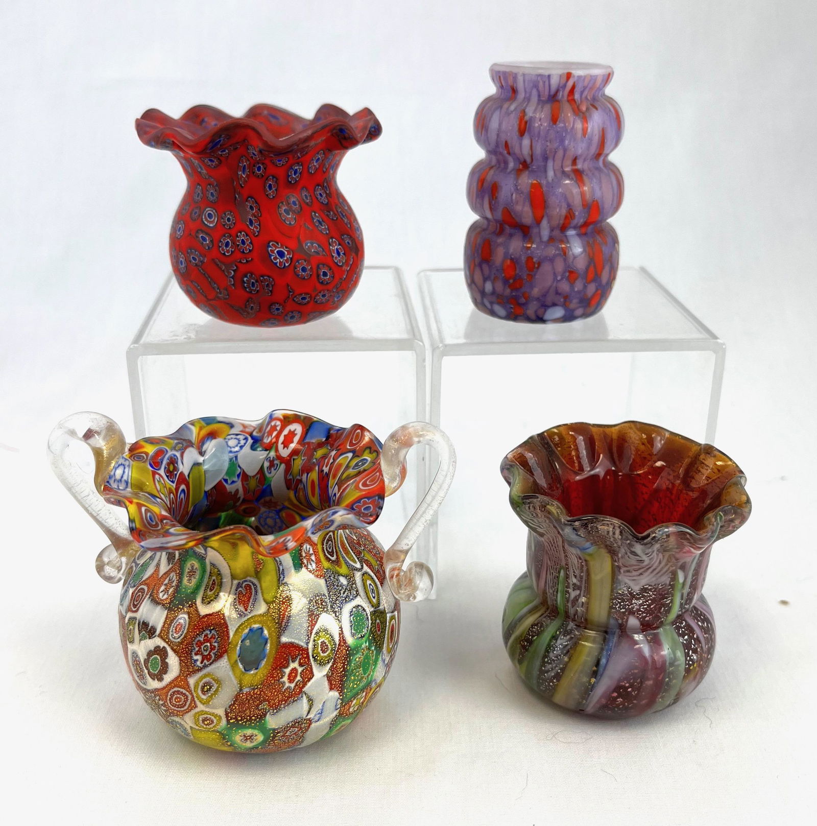 Four Italian Millefiori toothpicks: Four Italian colorful Millefiori toothpick holders, one with applied clear handles; tallest 3". CONDITION: good with no defects found.