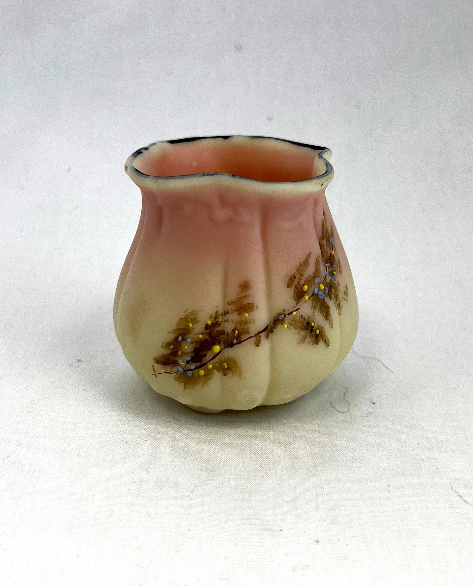 Mt. Washington Burmese toothpick: Mt. Washington Burmese toothpick holder with floral dŽcor; 2 1/4" ht. Literature: Mt. Washington Art Glass by Betty Sisk, p. 246. CONDITION: good with no defects found.
