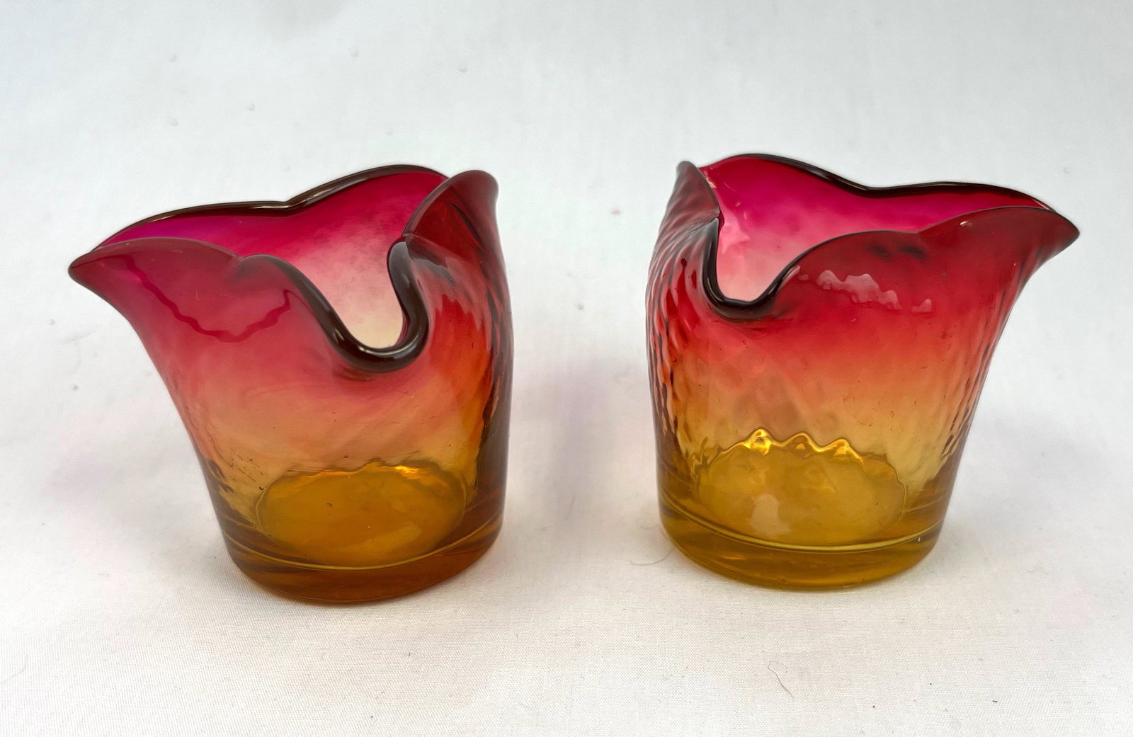 Two Amberina tri-fold toothpicks: Two Amberina tri-fold Optic Diamond toothpick holders; 2" ht. CONDITION: good with no defects found.