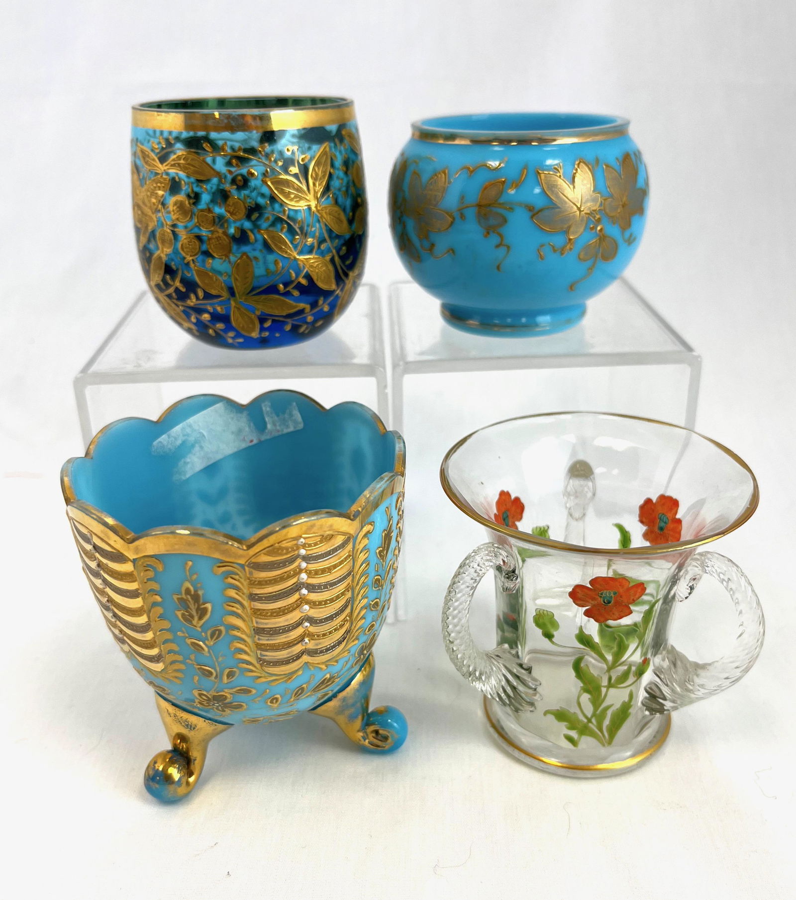Four Bohemian toothpick holders: Four Bohemian enameled toothpick holders including a RARE Myers Neff clear three handled with orange floral dŽcor, two blue opaline with gold dŽcor, one three footed, and a Prussian blue with gold d