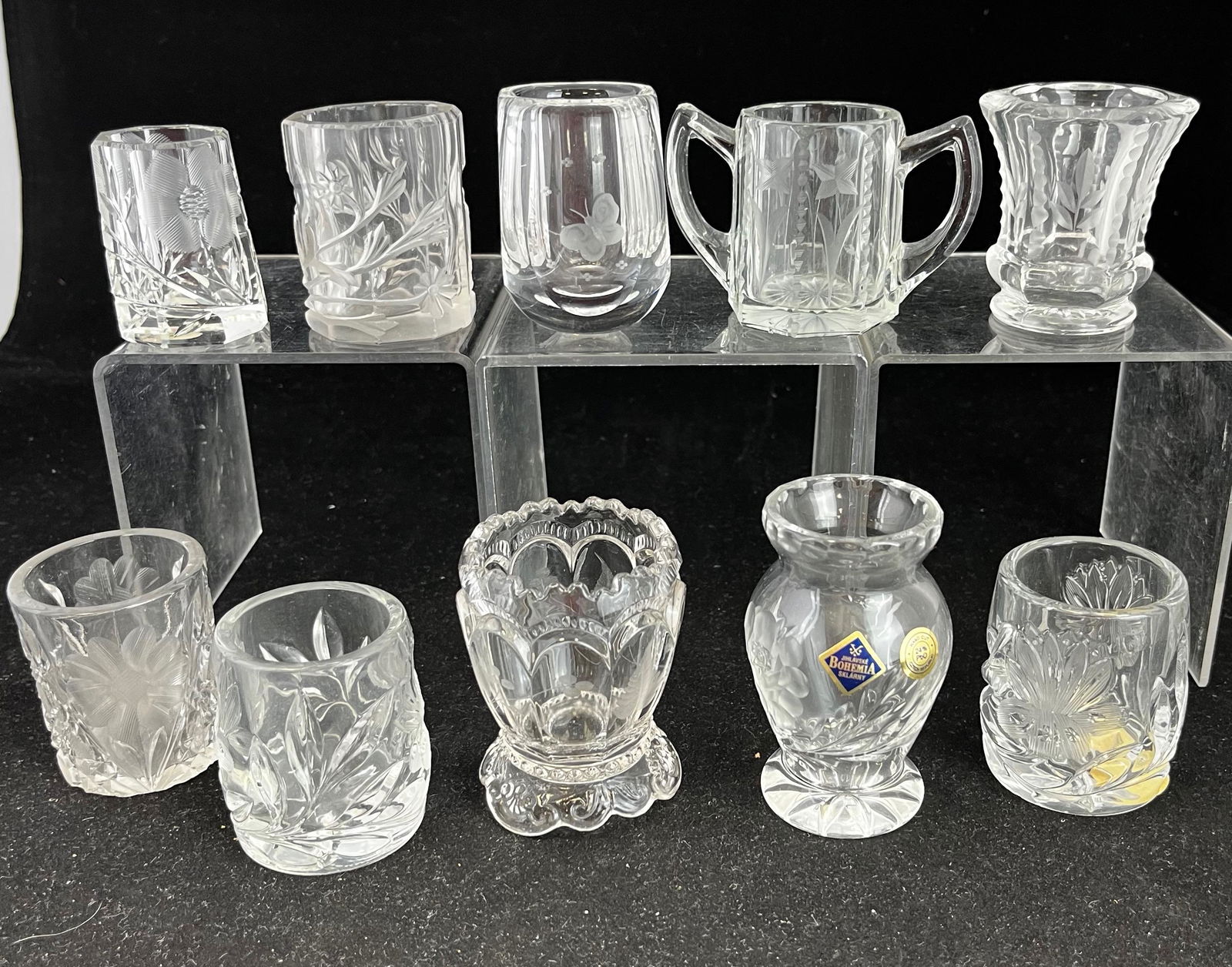 Group of 10 cut glass toothpicks: Group of 10 cut, Intaglio or etched glass toothpick holders, various makers and patterns; tallest 3". CONDITION: minor wear.