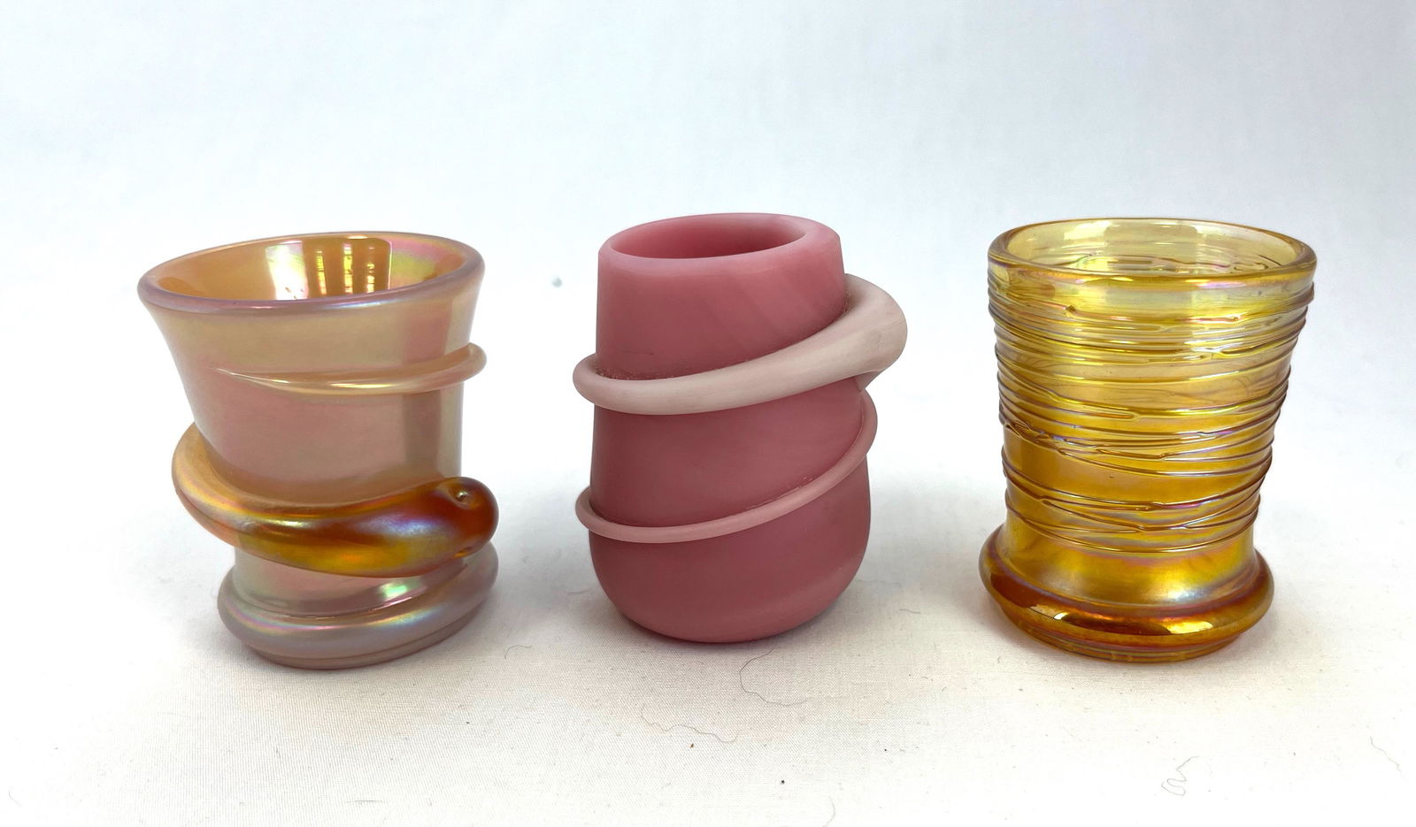 Three Terry Crider toothpick holders: Three Terry Crider signed toothpick holders, two with applique and one threaded; tallest 2 1/4". CONDITION: no defects noted.