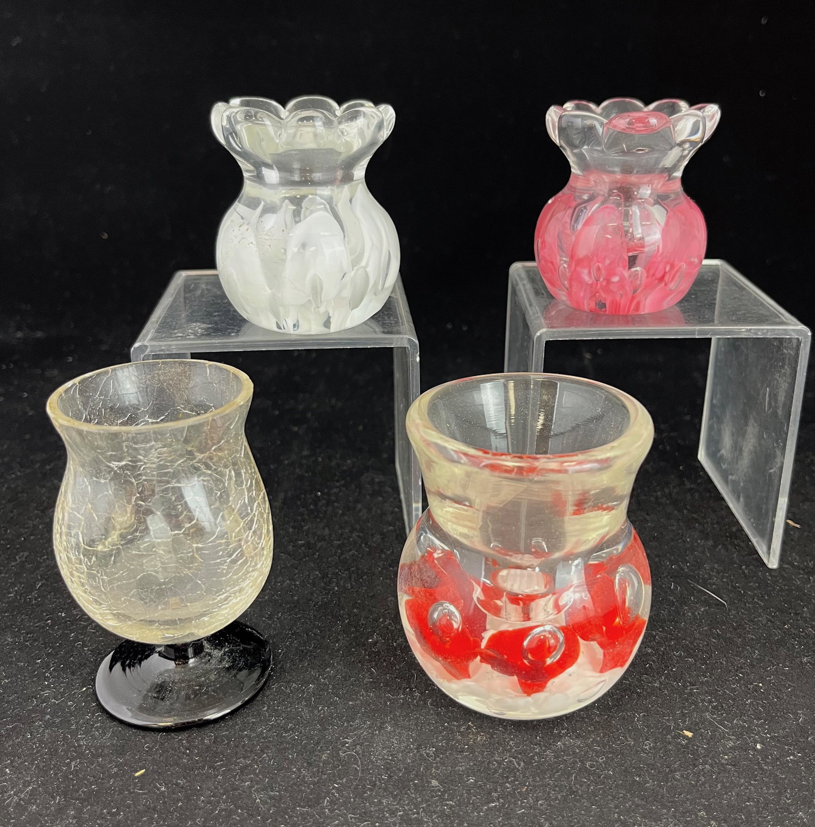 Four contemporary toothpick holders: Four contemporary paper weigh toothpick holders including two signed Jack Zimmerman, a signed Joe St. Clair, and a pedestal crackle; tallest 3". CONDITION: good, no defects found.