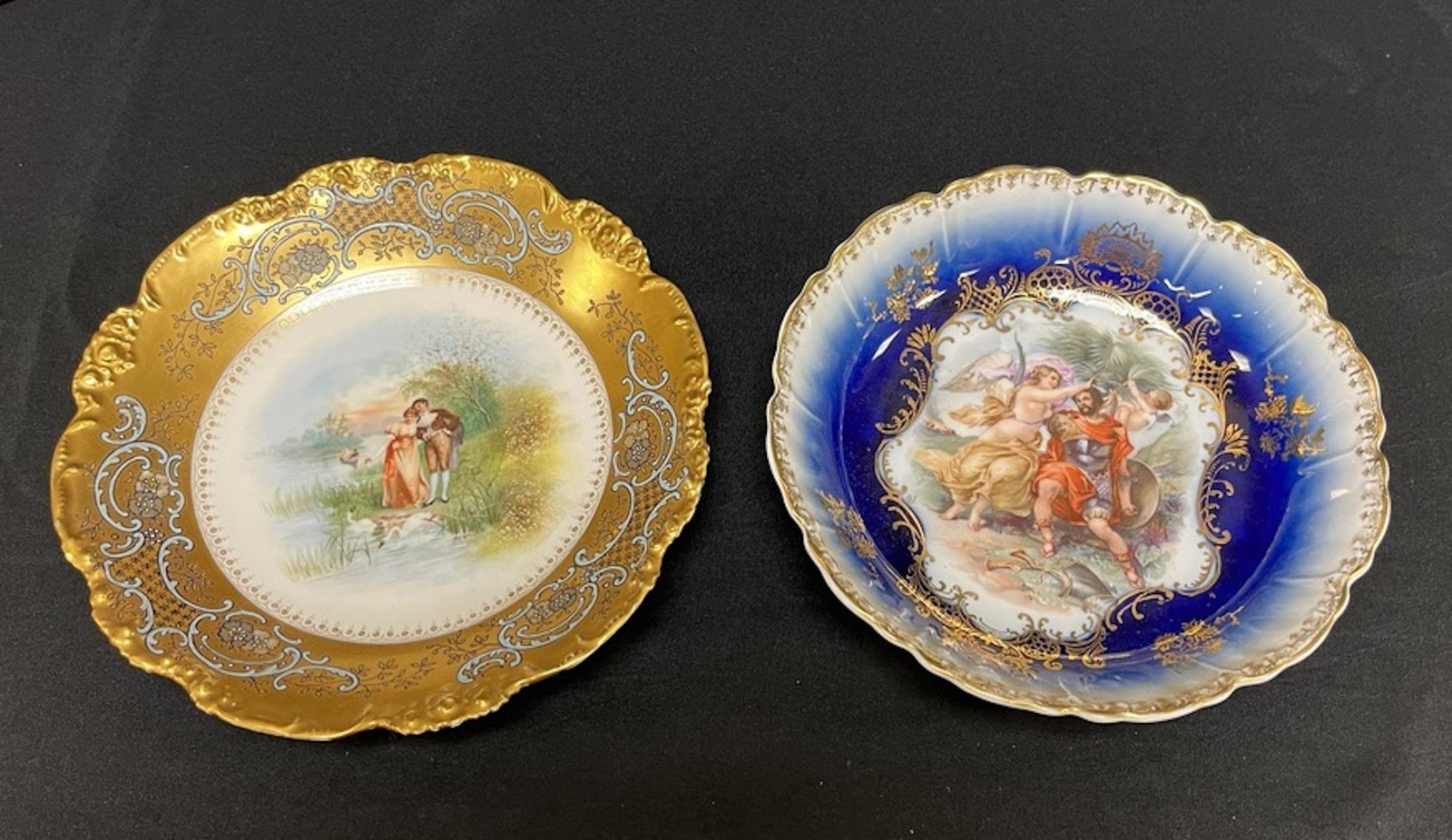 Two hand painted porcelain bowls: Two hand painted porcelain plates, one Courting Couple Limoges, one Royal Bavarian with Romanesque design; largest 9.5". CONDITION: good, no damage noted.