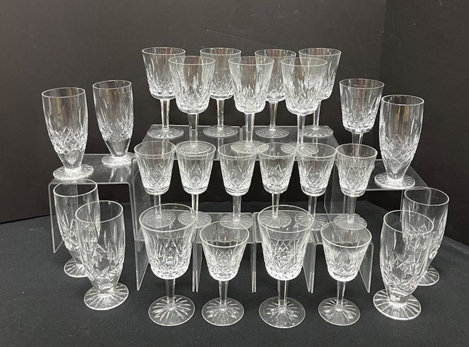 Large group of Waterford stems: Large group of Waterford stemware including water goblets and various size wine goblets in the Lismore pattern, tallest 7" ht. Condition: good with no defects found.