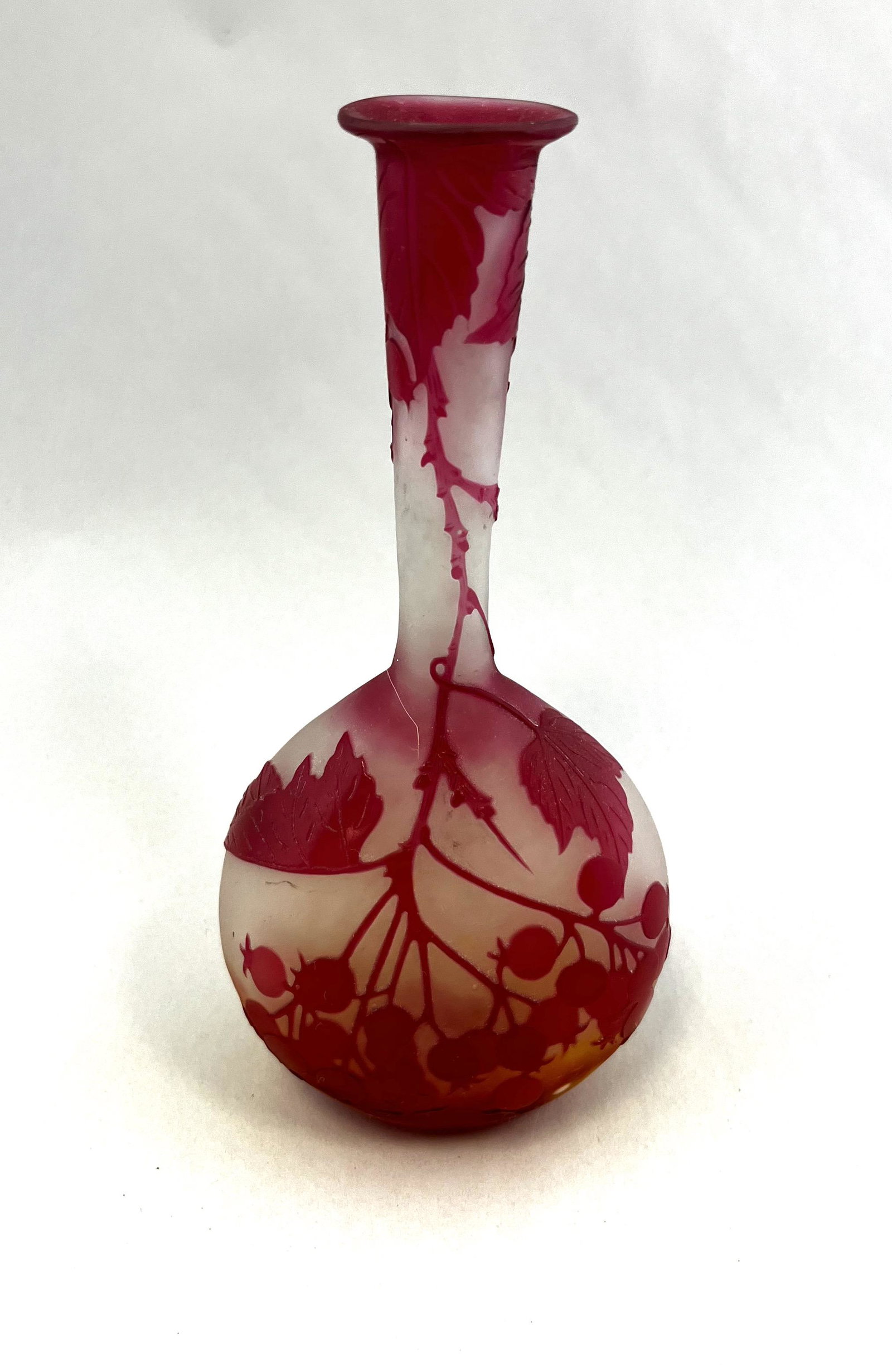 Galle French cameo glass vase: Galle banjo form cameo glass vase in frosted to yellow glass decorated with a Crimson cascading branch of leaves and berries, signed in cameo Galle 6 3/4" ht. Condition: good with no defects found.