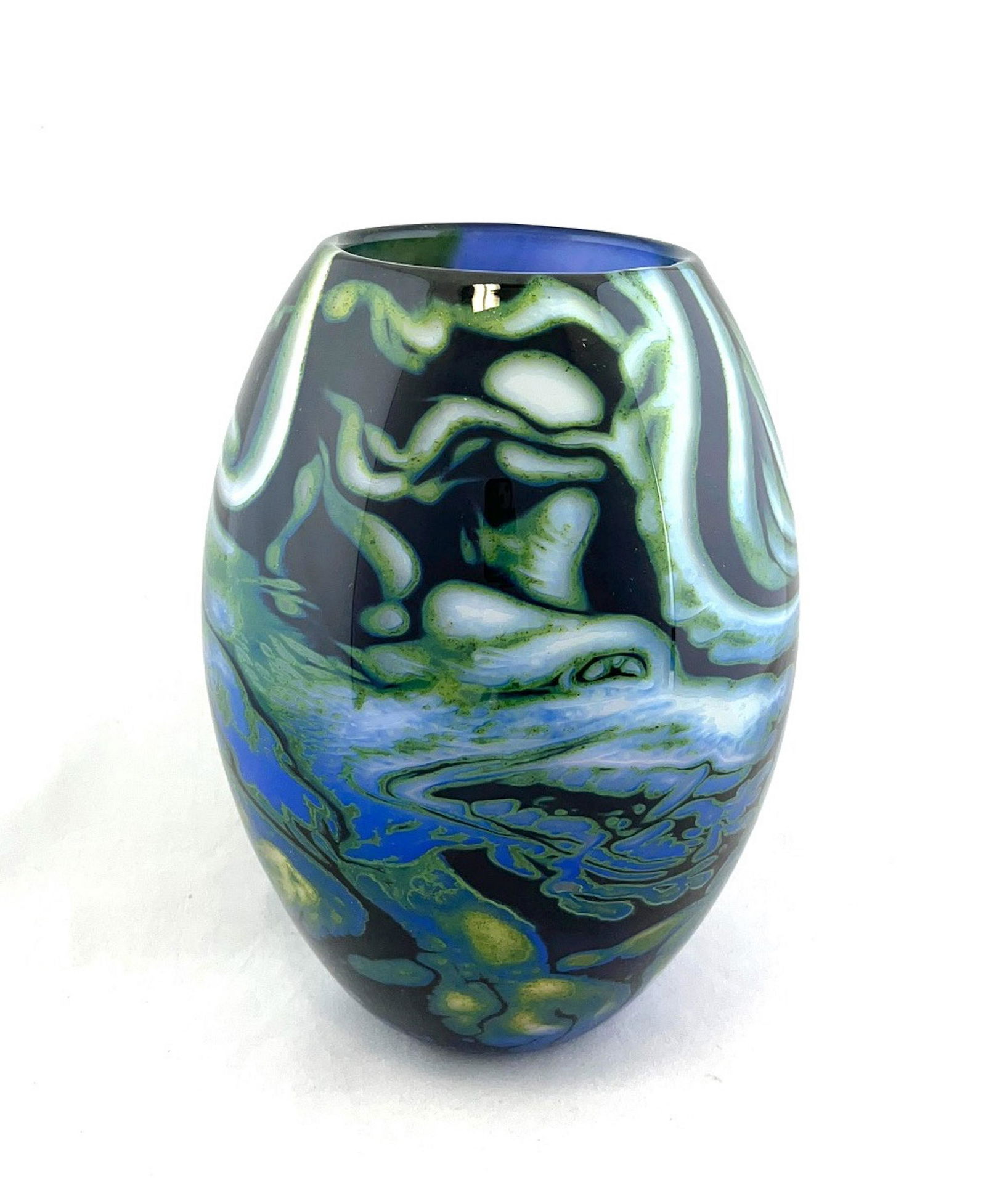 John Ford Graal art glass vase: John Form Graal art glass vase in heavy blue glass with aventurine green clouds decorated with an internal dragon and whimsical fairy, signed Jon Ford Graal Devon England 1988, 9" ht. Condition: good