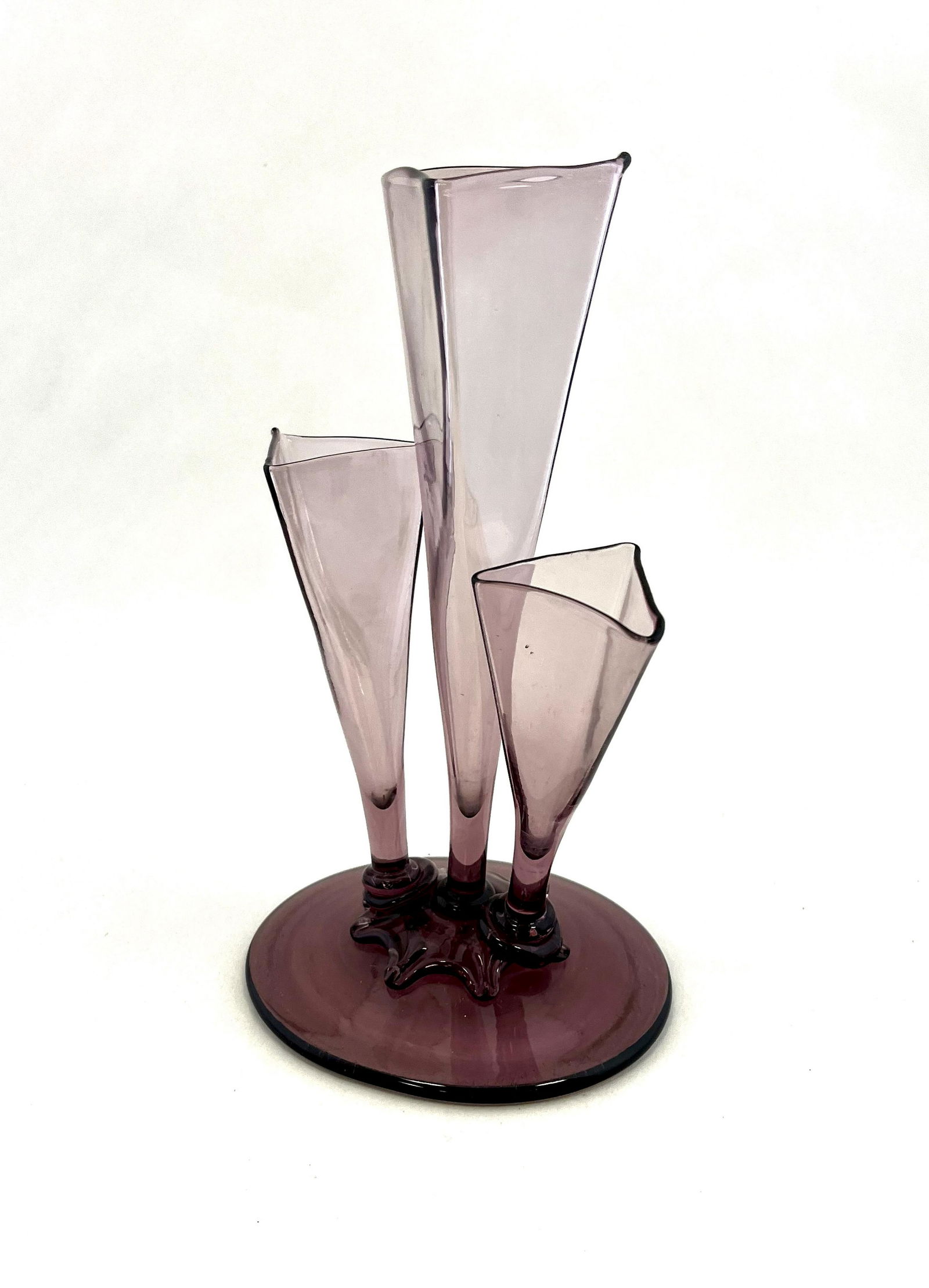 Steuben three prong vase: Footed Art Deco three prong vase, shape number 6873, in purple glass, 10" ht. CONDITION: good with no defects found.