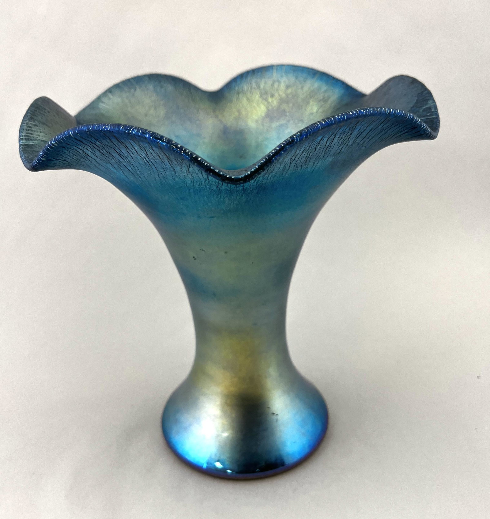 Steuben Blue Aurene flaring vase: Steuben Blue Aurene corset shape vase with a scalloped flaring rim, signed Aurene 723, 7 1/2" ht. CONDITION: good, very minor scratches.
