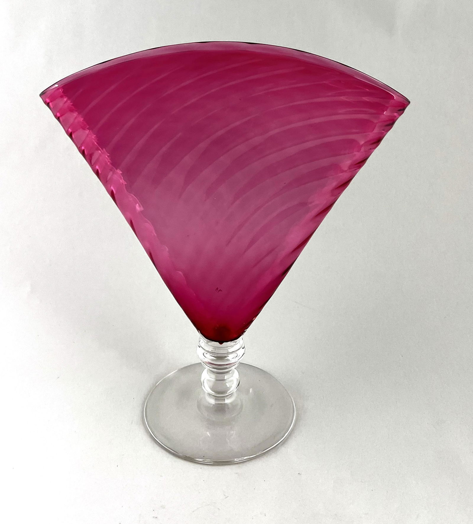 Steuben Gold Ruby fan vase: Steuben Gold Ruby (cranberry) fan vase with an optic swirl, signed with a Steuben Fleur-de-Lis, 8 1/2" ht. CONDITION: good with no defects found.