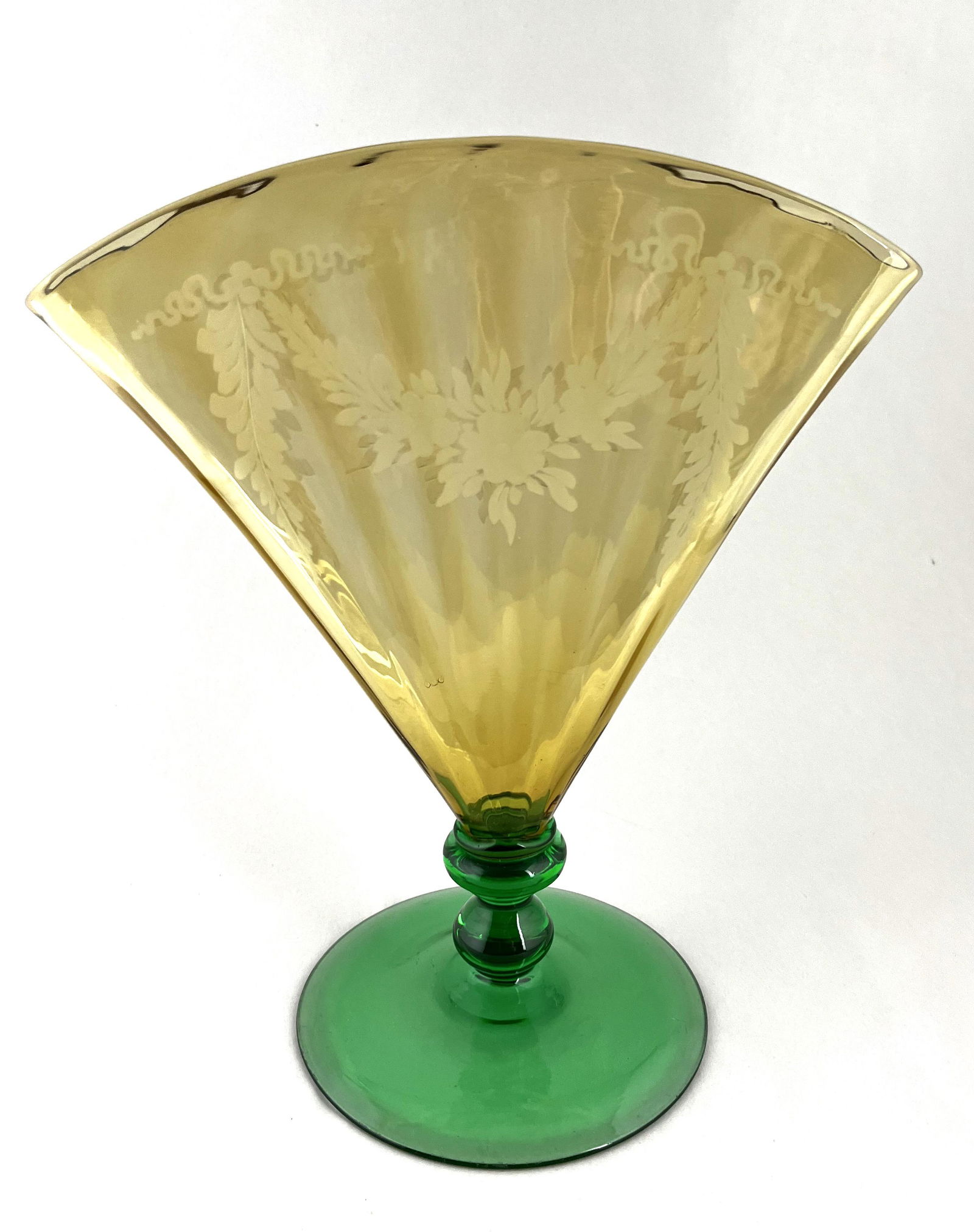Large Steuben fan vase: Steuben amber optic ribbed fan vase with a Pomona foot decorated with etched flower garlands. 10 3/4" ht. CONDITION: good with no defects found.