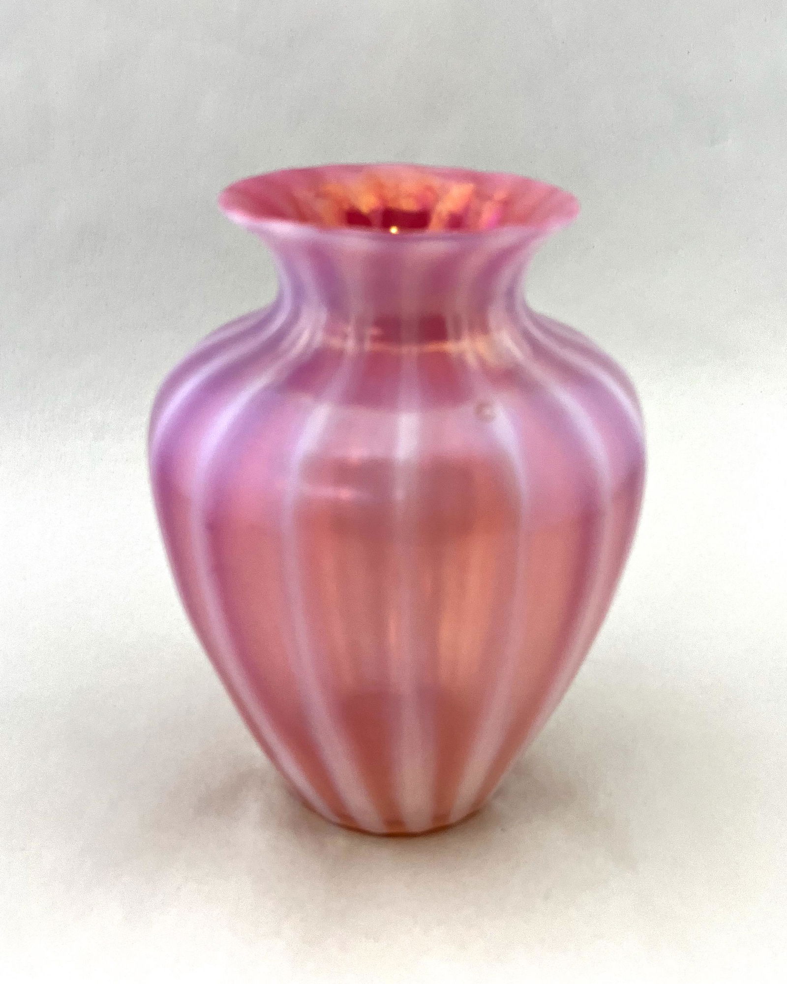 Steuben Oriental Poppy glass vase: Steuben shouldered form Oriental Poppy glass vase with opalescent ribs, 6" ht. CONDITION: good with no defects found.