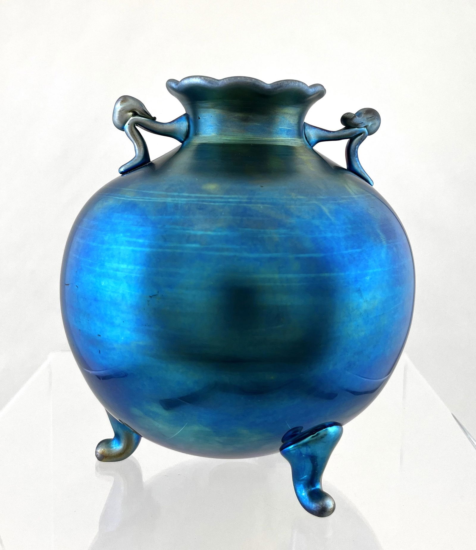 Steuben Blue Aurene glass vase: Steuben globular vase with three scrolling feet and two applied handles, signed Steuben Aurene 6117, 5 1/2" ht. CONDITION: good with no defects found.