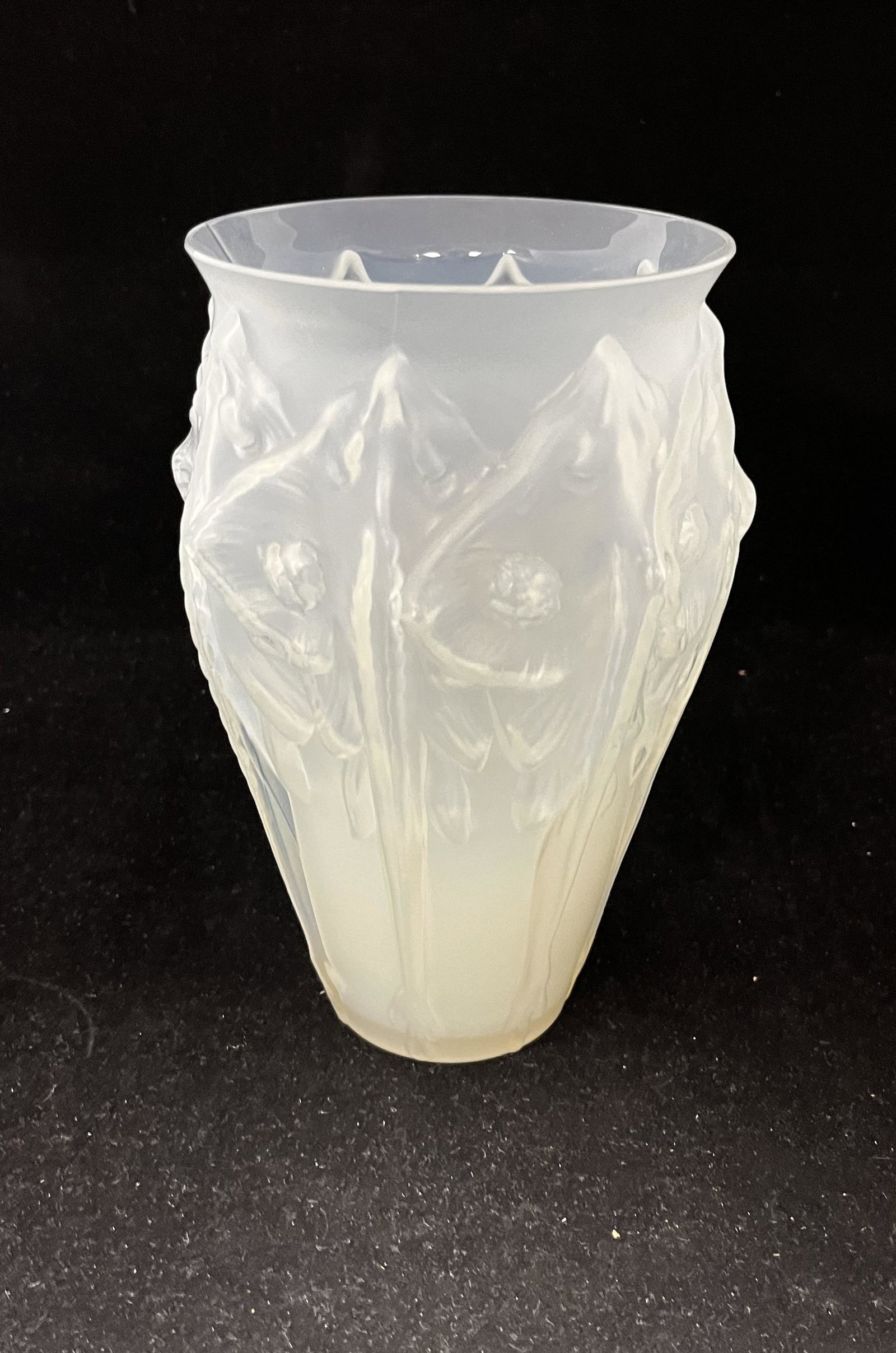 Sabino art glass vase: Sabino opalescent art glass vase with raised poppies, signed Sabino and carries a paper label, 8 1/4" ht. Condition: good with no defects found.