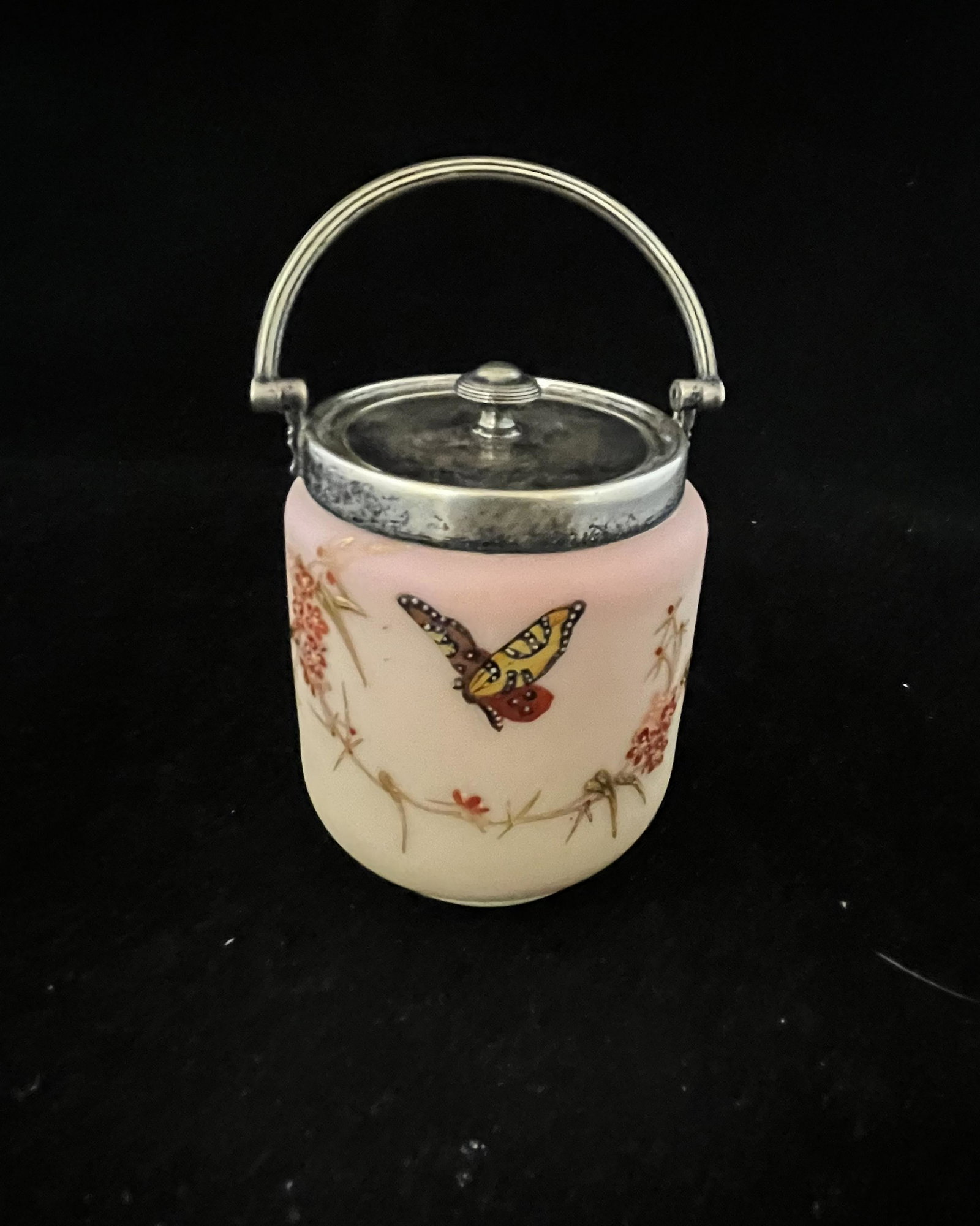 Webb Burmese Sweet Meat jar: Webb cylindrical Burmese covered sweet meat jar decorated with red berries and a butterfly, signed with a Thomas Webb and Sons acid stamp, 4 1/2" ht. without handle. CONDITION: good with no defects fo