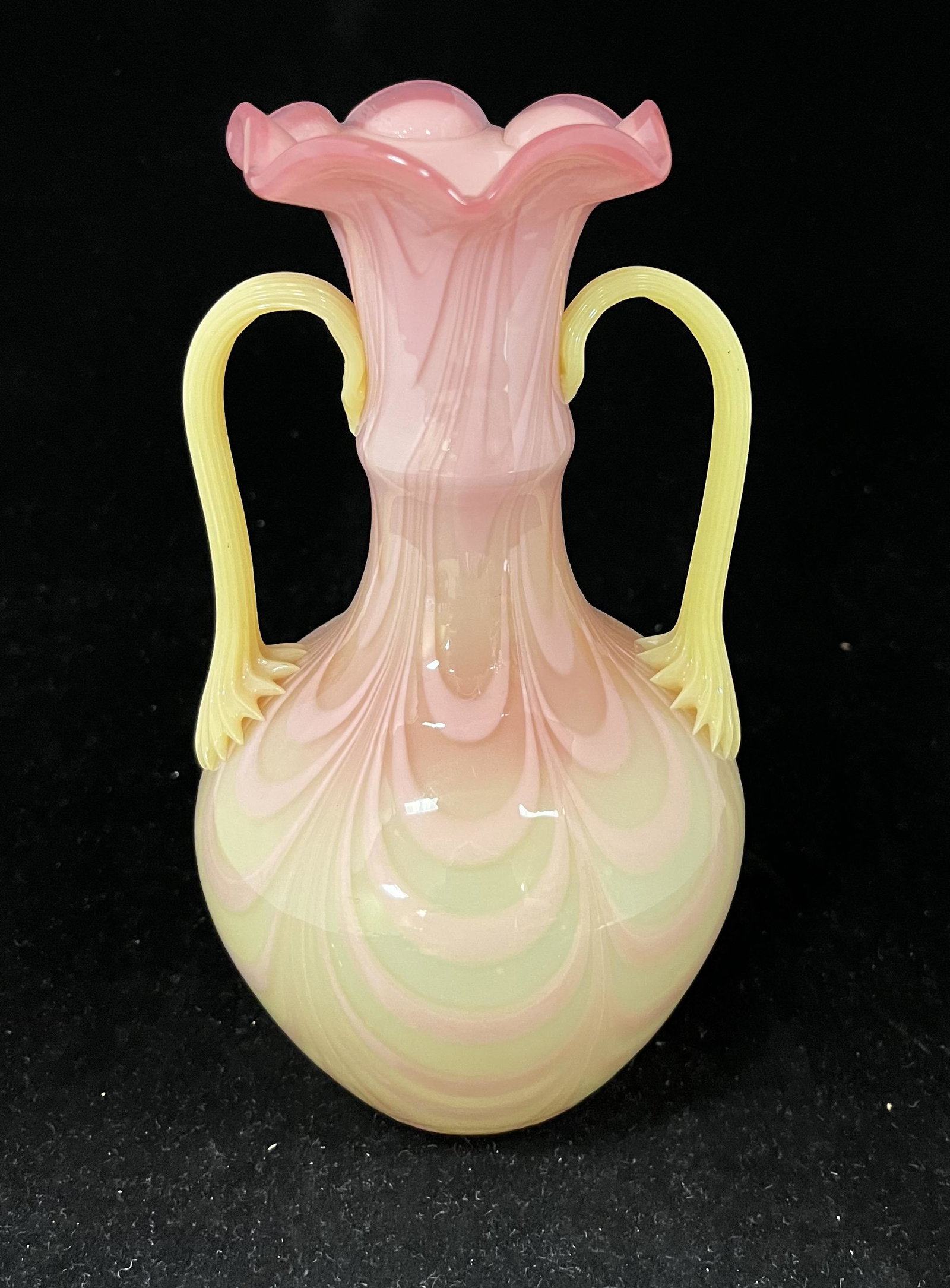 Mid Century Burmese two handle vase: Mid Century Burmese two handle vase with swags and two reeded handles, 7 3/4" ht. CONDITION: good with no defects found.