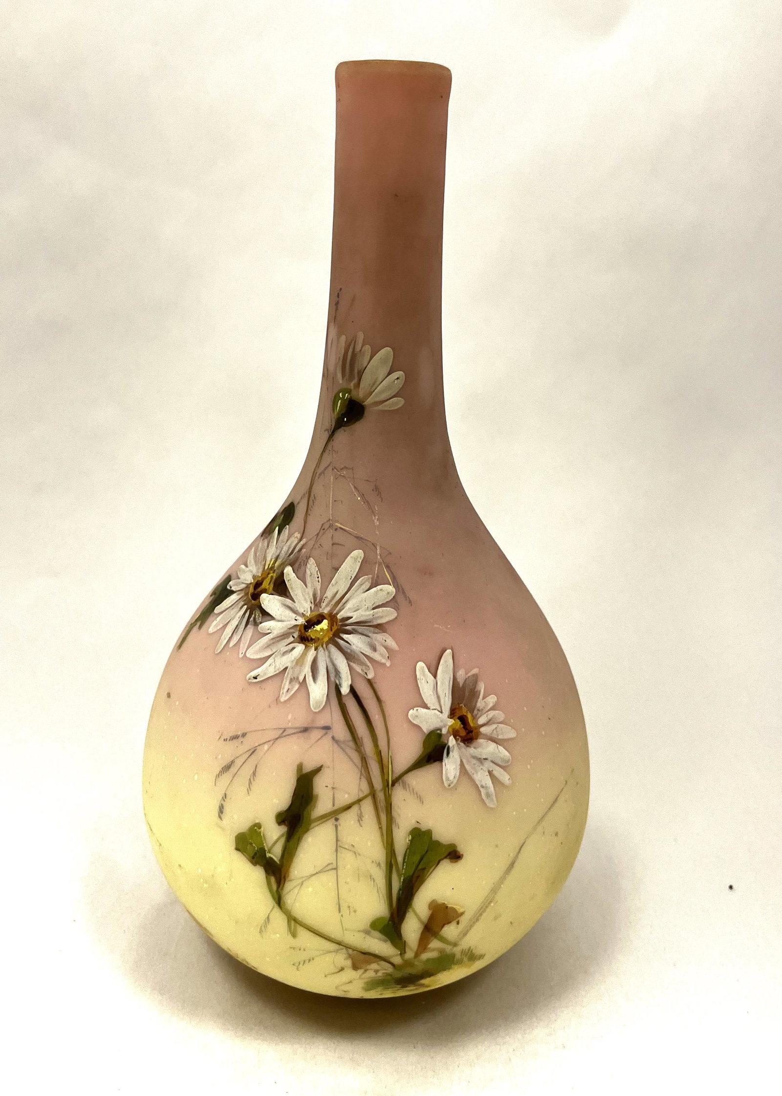 Mt. Washington Burmese vase: Mt. Washington bulbous Burmese vase decorated with stemmed daisies, 8 1/2' ht. CONDITION: good with no defects found.