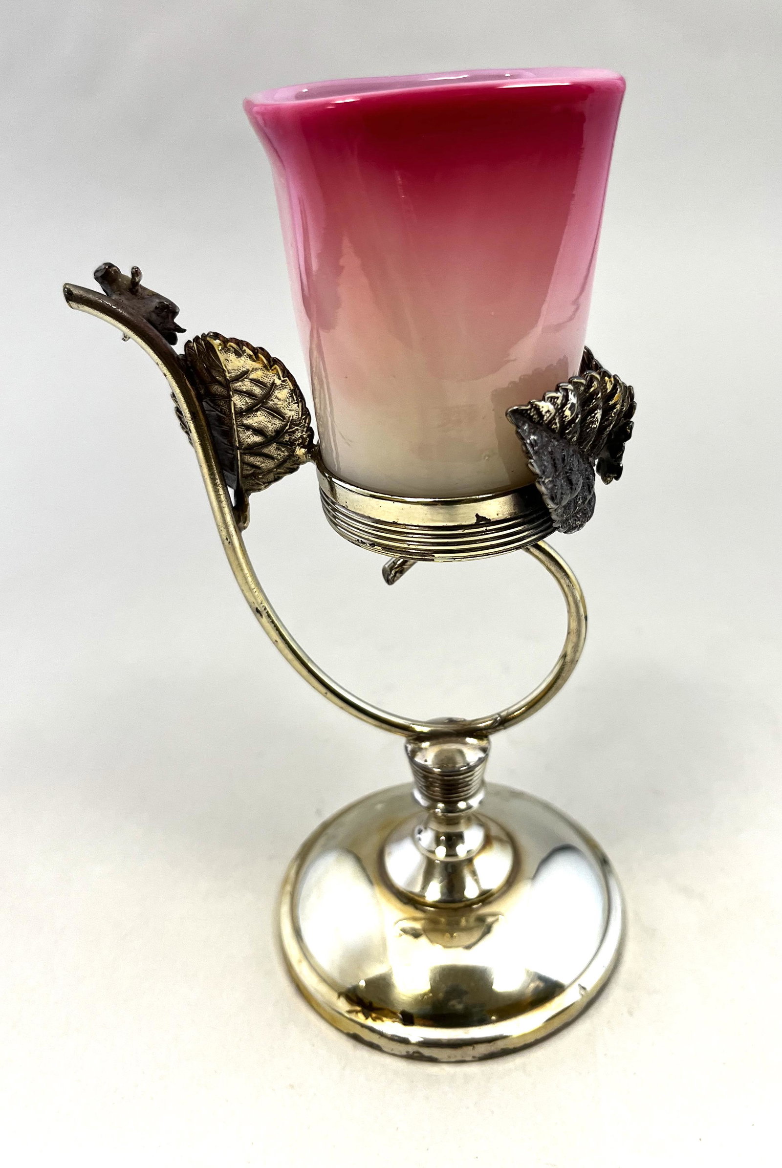 New England Peachblow glass toothpick: New England square mouth Peachblow toothpick in a glossy finish set in a silver plate Derby leaf embossed caddy, 6 1/2" ht. CONDITION: good with no defects found.