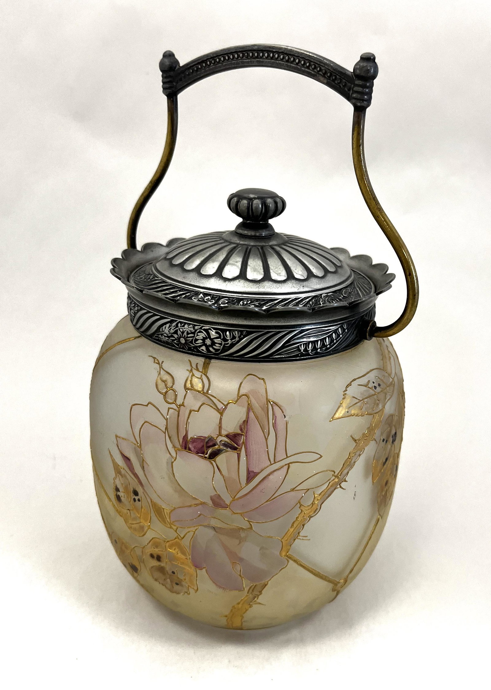 Mt. Washington Royal Flemish jar: Mt. Washington Royal Flemish cracker jar with raised panels decorated with large pink flowers on thorny branches, marked with the RF factory stamp and embossed lid signed Pairpoint, 8" ht. CONDITION: 