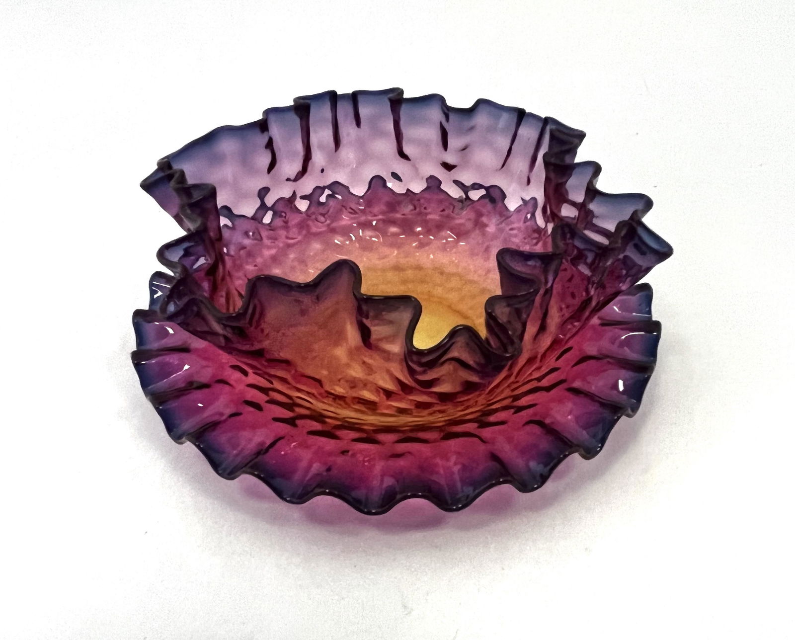 Webb Alexandrite finger bowl and plate: Webb Alexandrite finger bowl and underplate with a ruffled rim in the honeycomb pattern, 5 1/2" wide. CONDITION: good with no defects found.