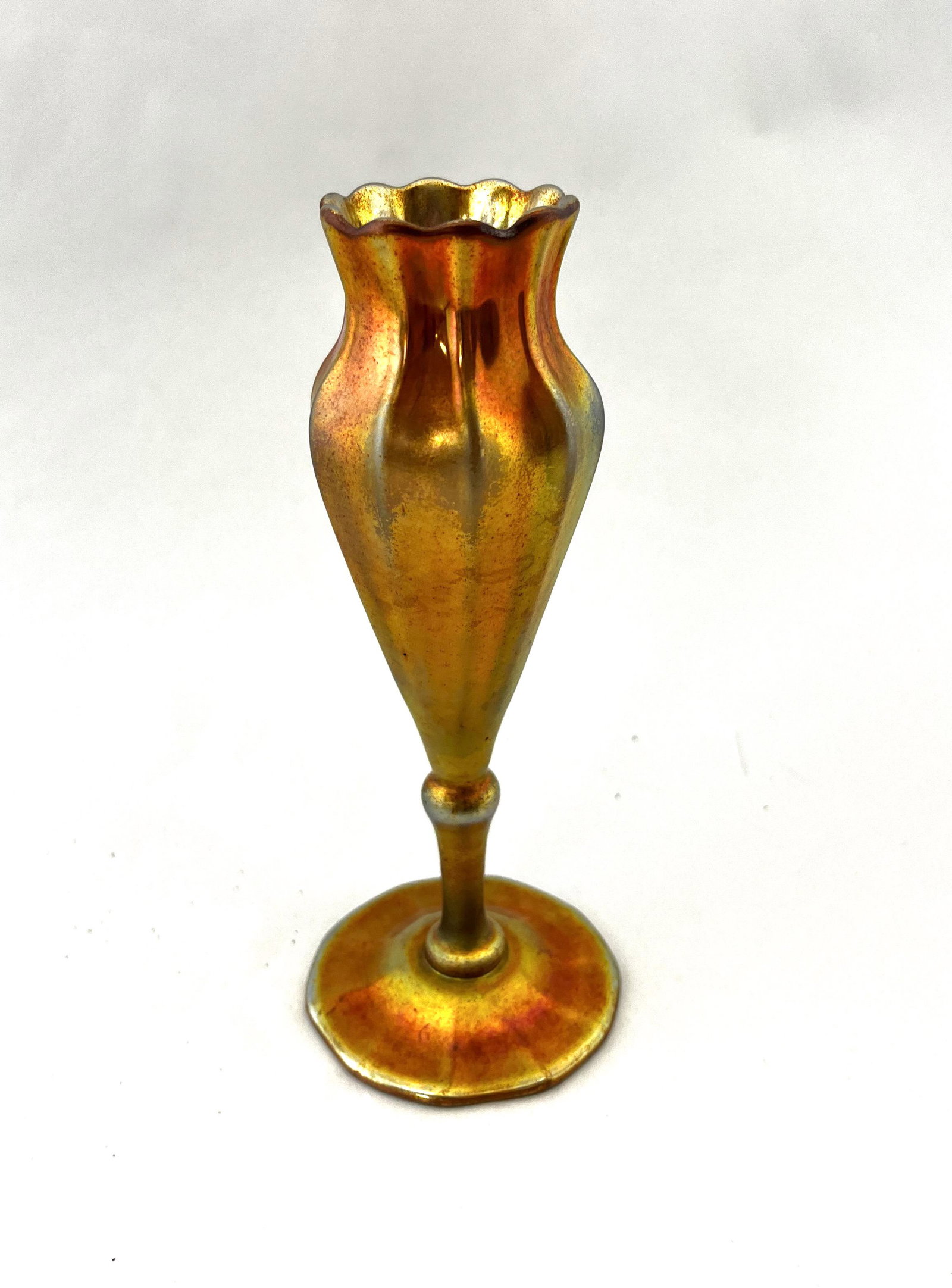 Tiffany Gold Favrile flower form: Tiffany Gold Favrile flower form vase with an optic ribbed pattern, spurious Aurene signature, 6 1/4' ht. CONDITION: good with no defects found.