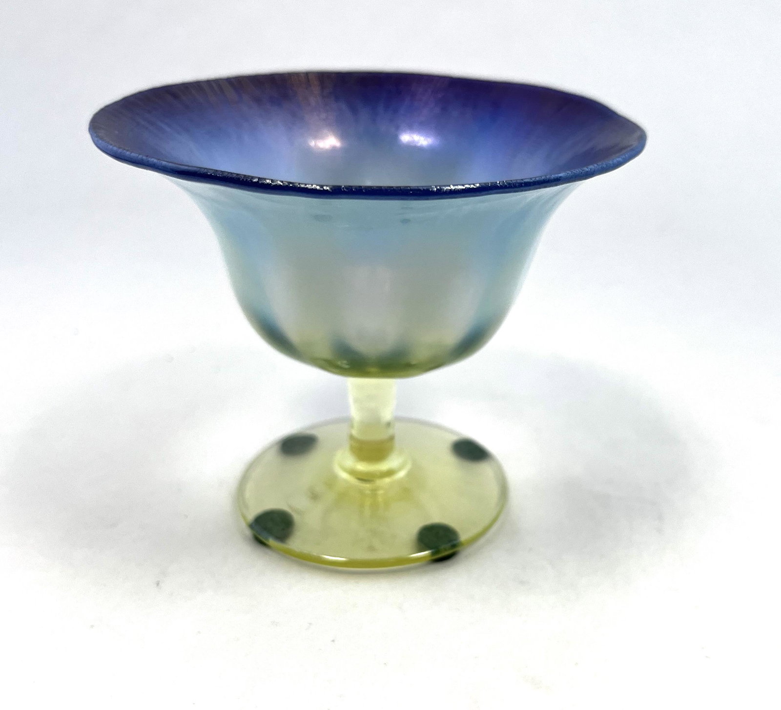 Tiffany Favrile Pastel sherbet: Tiffany Blue Favrile Pastel sherbet with a amber stem, signed L C T Favrile, 3 1/2" ht. CONDITION: good with no defects found.