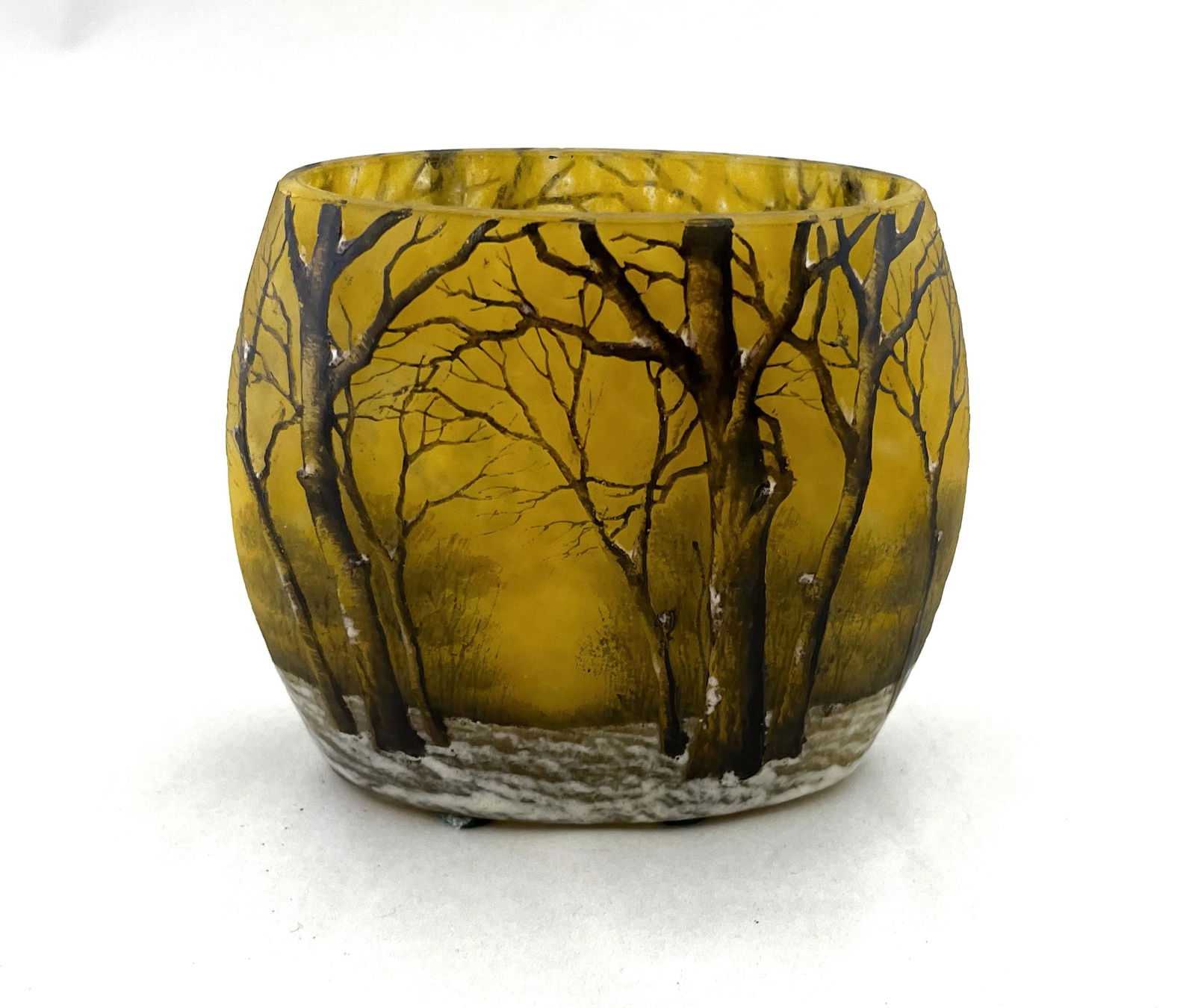 Daum Nancy French cameo glass vase: Daum Nancy pillow form cameo glass vase in the iconic winter scene of bear trees in a snow covered forest, signed Daum Nancy, 4" ht. by 5" wide. CONDITION: good with no defects found.