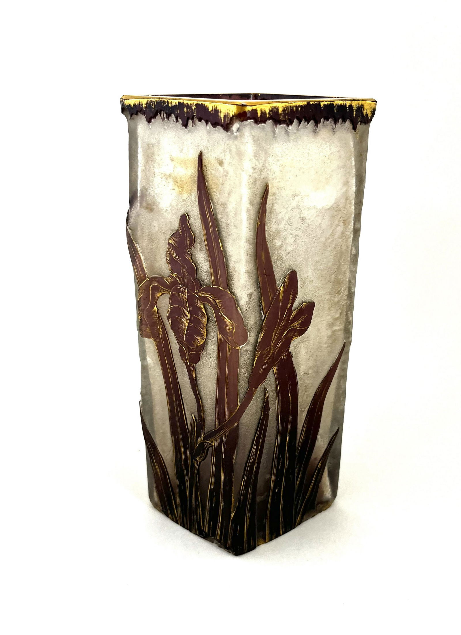 Daum Nancy French cameo glass vase: Triangular form Daum Nancy glass vase in textured glass decorated with a purple iris with gilt highlights, signed Daum Nancy, 7" ht. CONDITION: chipping on the base see pictures