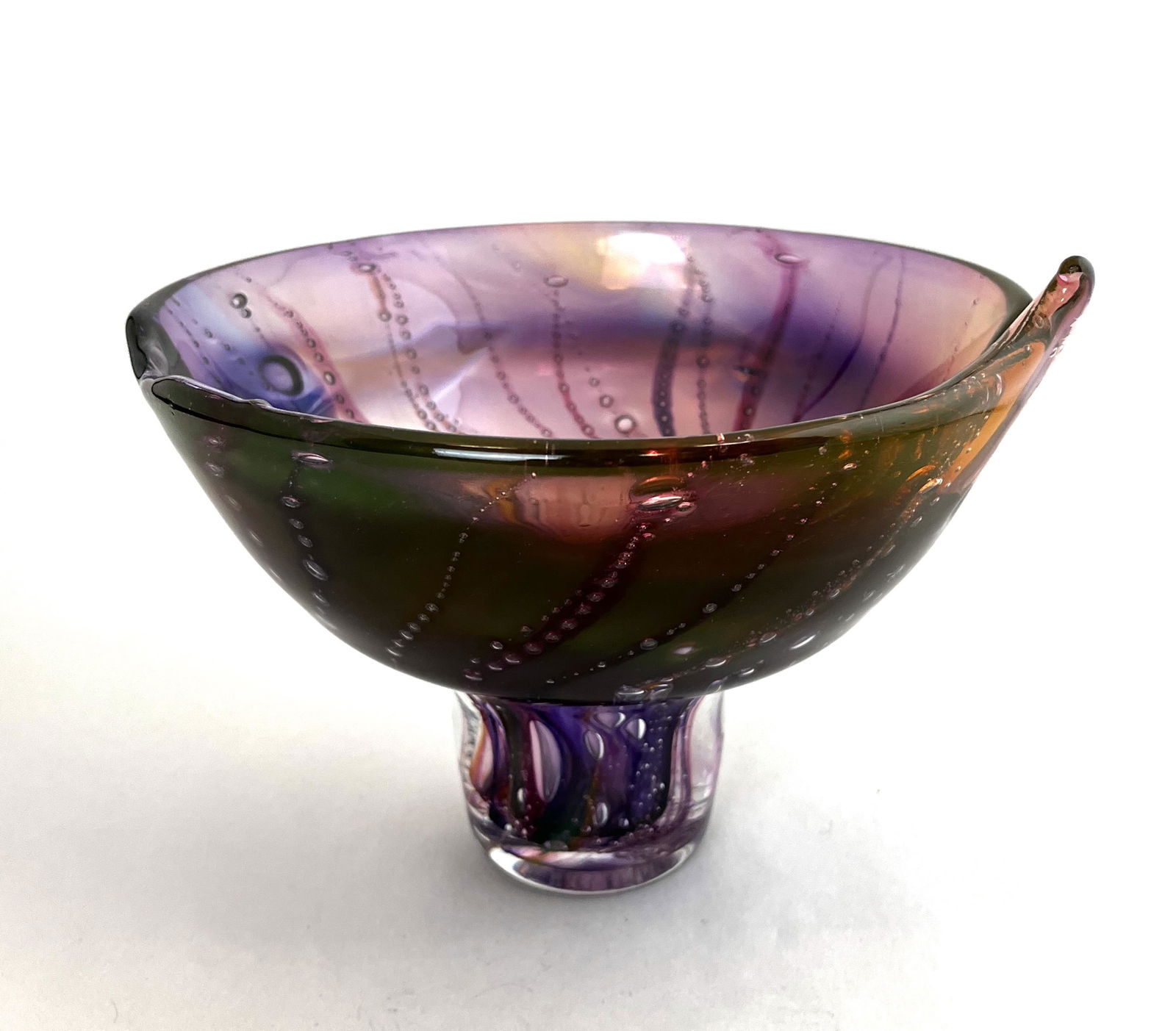 Rare early Leon Applebaum glass vase: Free form Leon Applebaum compote sculpture in translucent amber and purple with rows of bubbles, signed Leon Applebaum 1982, 6" ht. by 9" wide. Condition: good with no defects found.