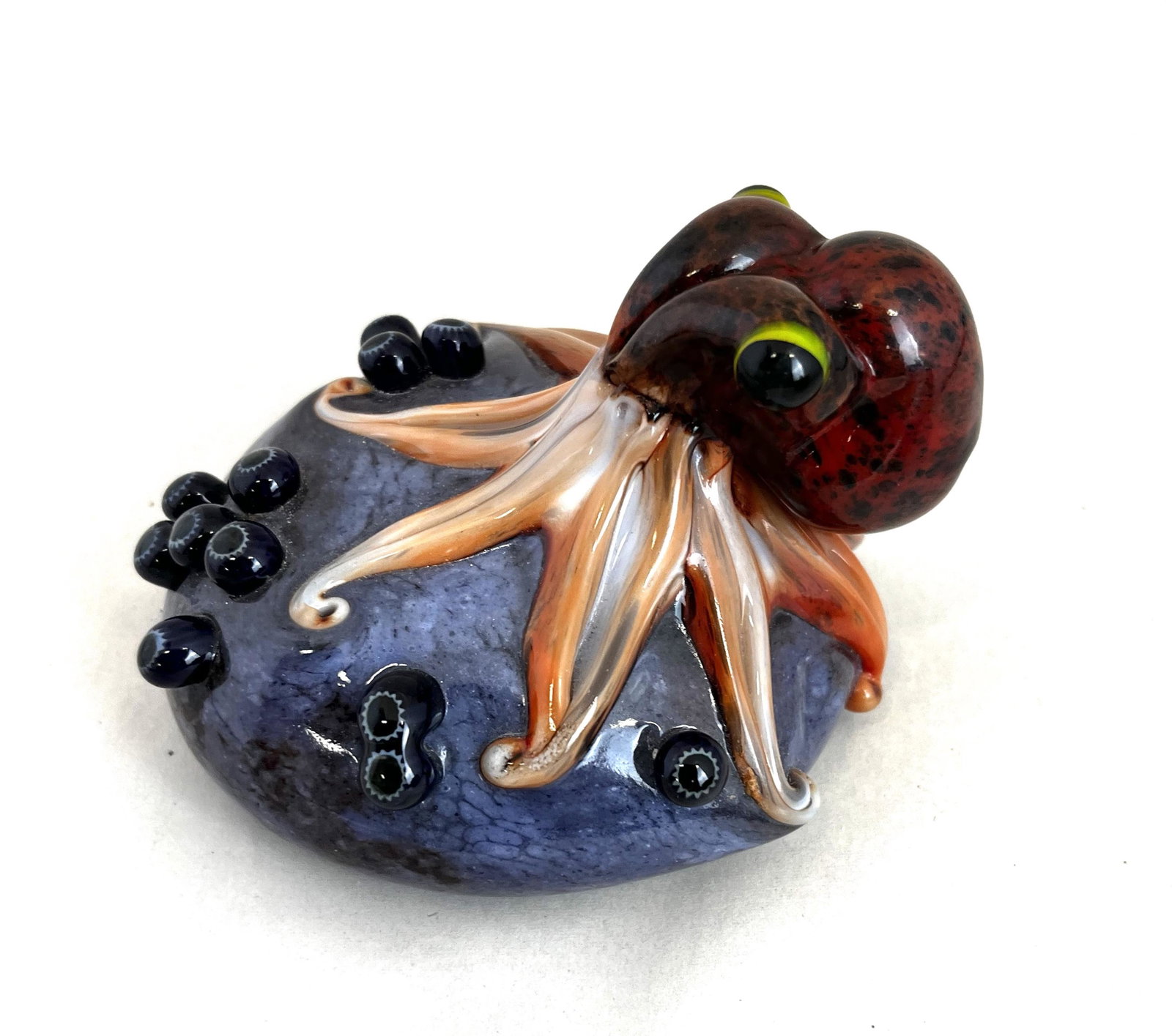 Orient and Flume figural paperweight: Orient and Flume purple paperweight with a figural Octopus, comes with original box, signed Smallhouse Orient and Flume, 4" wide. CONDITION: good with no defects found.
