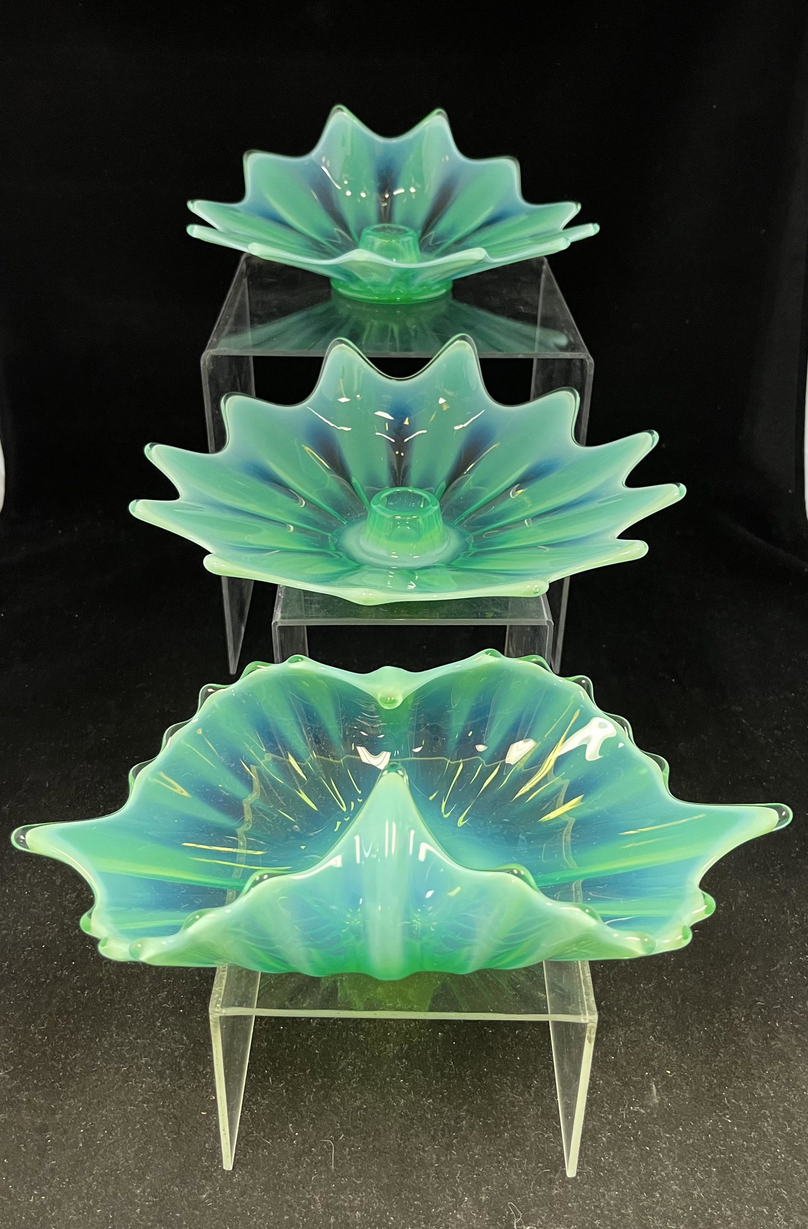 Three Fostoria Heirloom items: Three Fostoria Heirloom glass items including a tray and two candlesticks, 9" wide. CONDITION: Good with no defects found