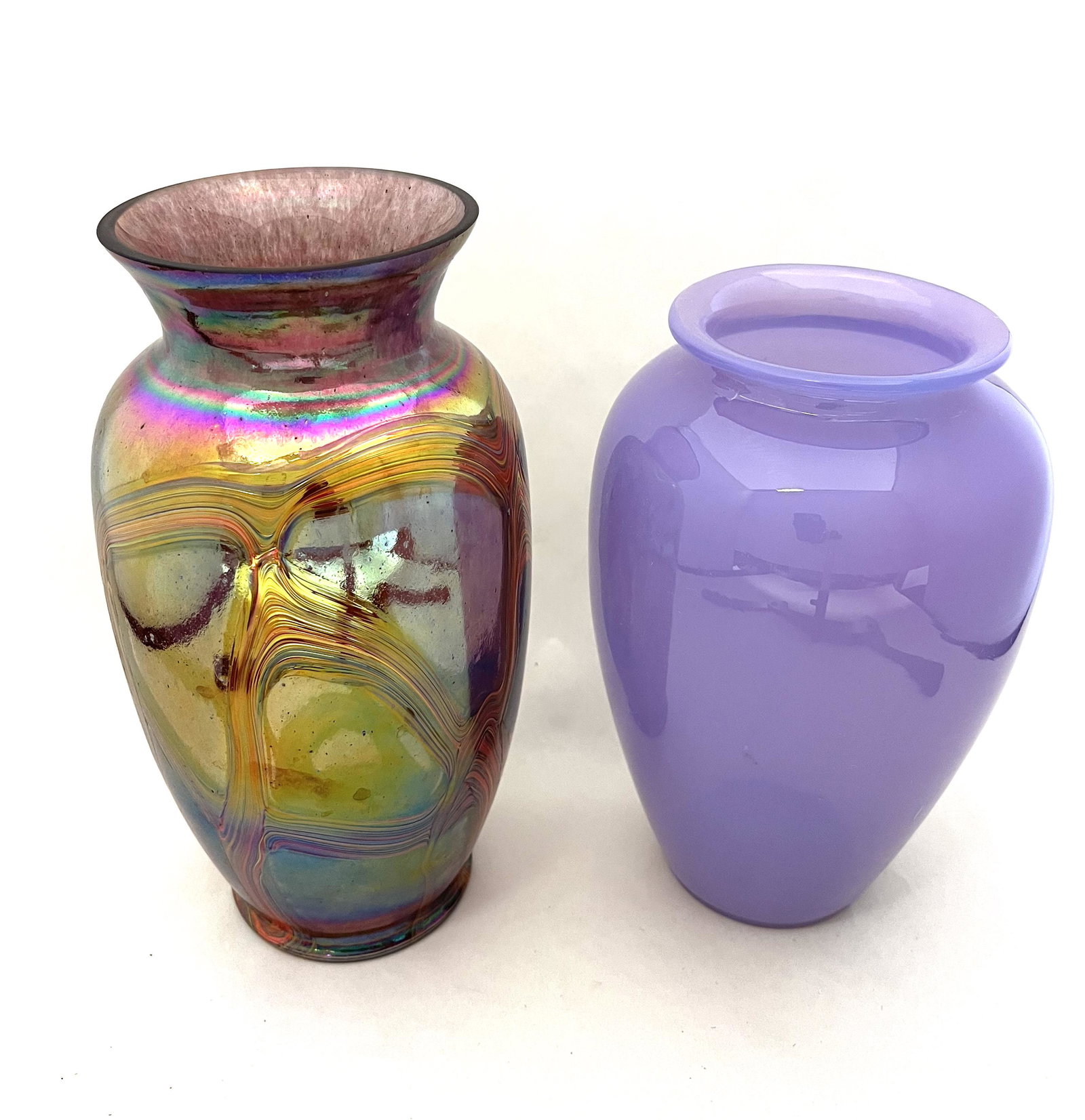 Two Czechoslovakia art glass vases: Two Czechoslovakia art glass vases including a purple opaline together with a iridescent purple shouldered vase with red and yellow ribbon design, tallest 9" ht. CONDITION: Good with no defects found