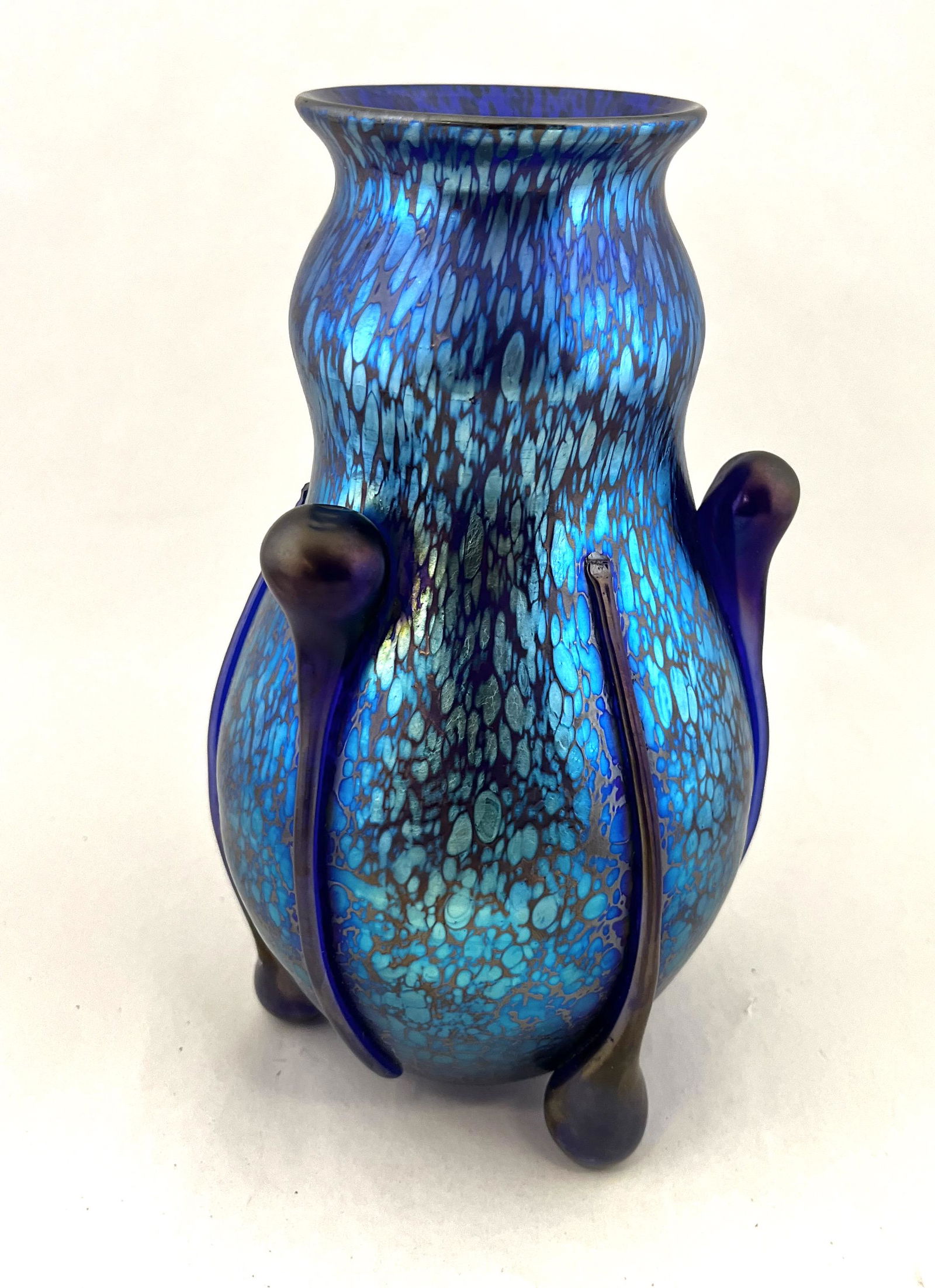 Loetz tear drop blue glass vase: Loetz blue Papillon gourd form with six side tear drop feet and handles, signed Czecho-Slovakia, 9" ht. CONDITION: Good with no defects found.