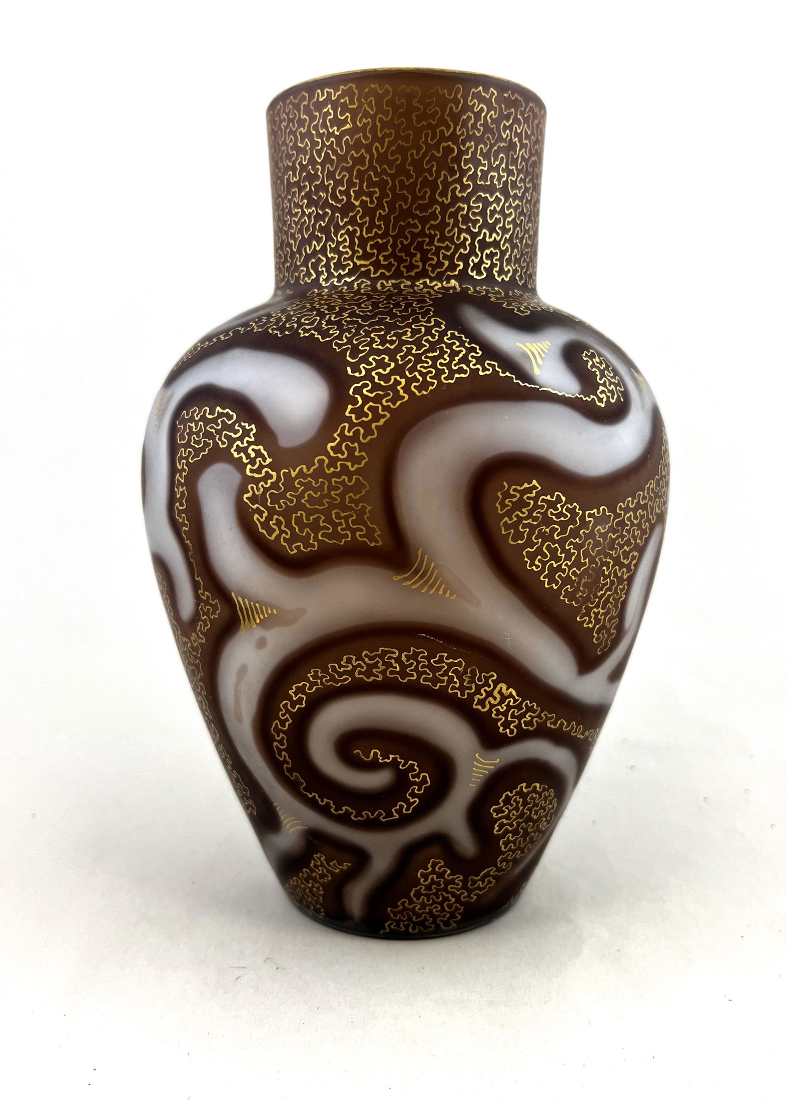 Loetz Federzeichnung glass vase: Loetz MOP Federzeichnung glass vase in brown MOP decorated with an octopus air trap trailing, overall gold tracery, excellent color, signed Patent 6 3/4" ht. CONDITION: Good with no defects found.