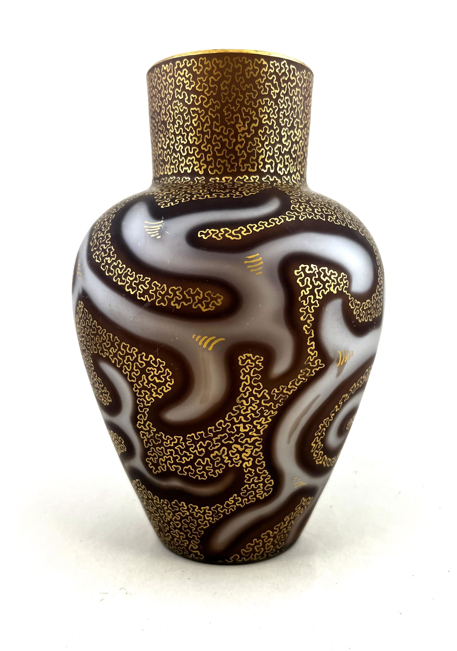 Loetz Federzeichnung glass vase: Loetz MOP Federzeichnung glass vase in brown MOP decorated with an octopus air trap trailing, overall gold tracery, excellent color, signed Patent 6 3/4" ht. CONDITION: one internal bruise, see pictur