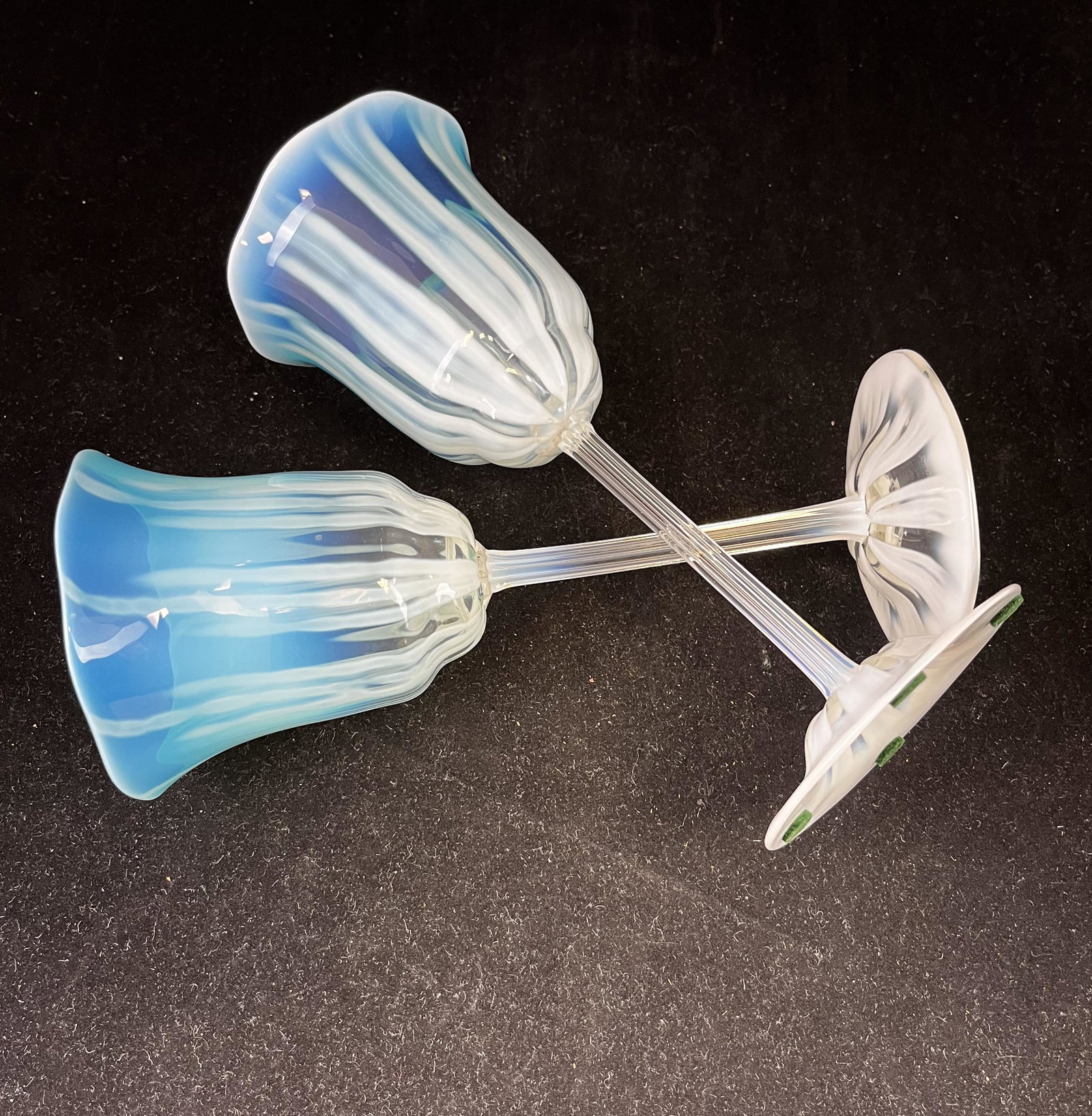 Pair of Tiffany green pastel goblets: Pair of Tiffany green pastel goblets with opalescent stripes, signed LCT Favrile, 8 3/4' ht. CONDITION: Good with no defects found