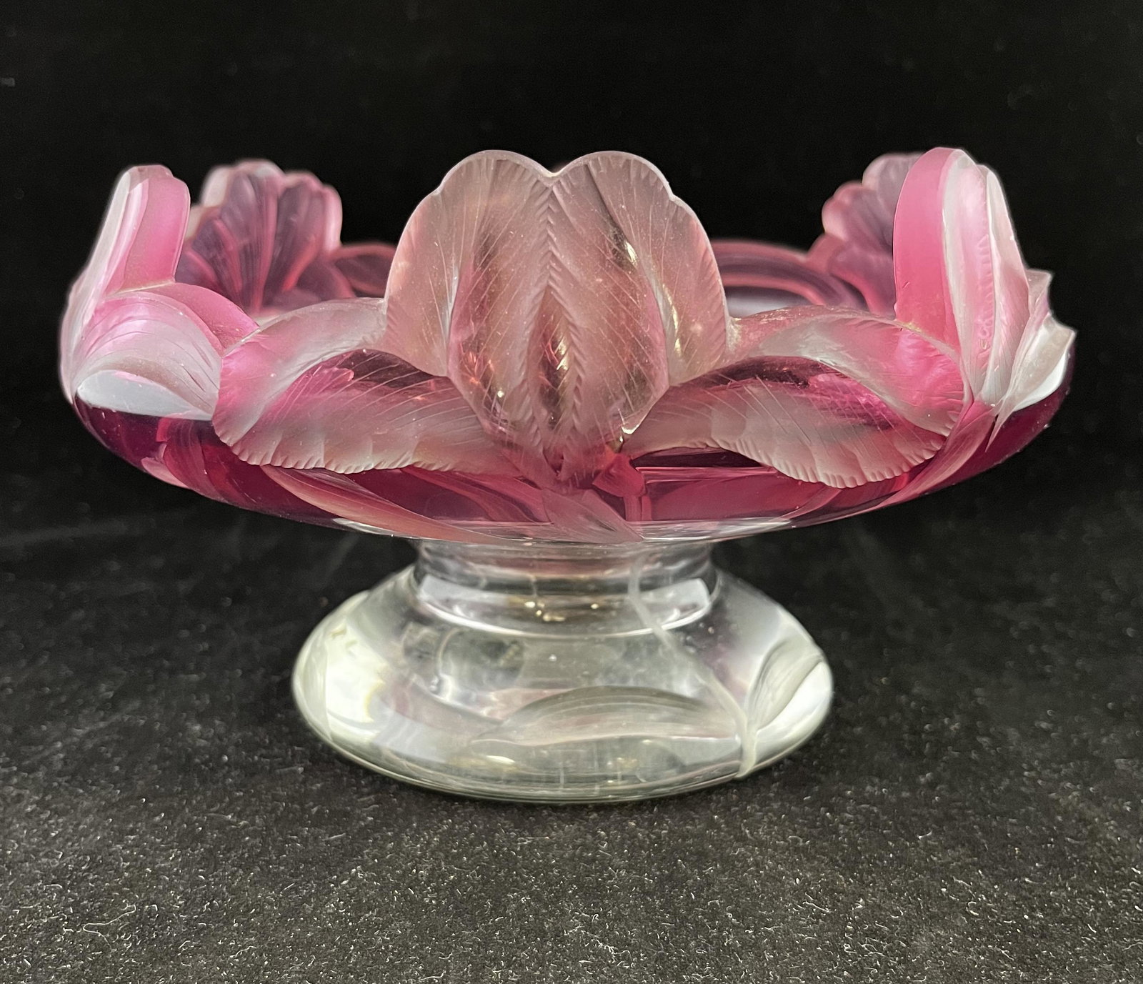 Moser Intaglio cut bowl: Moser footed bowl in clear glass graduating to pink decorated with stemmed intaglio cut flowers, 7 1/2" wide. CONDITION: Good with no defects found.