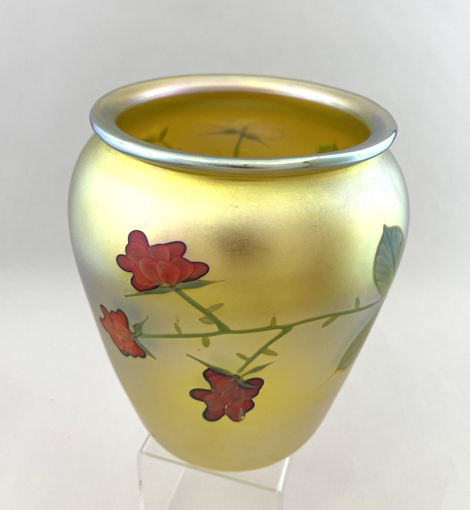 Orient and Flume art glass vase: Orient and Flume iridescent gold glass vase decorated with padded red and white dogwood flowers, signed O F 1983, 6 3/4" ht. CONDITION: Good with no defects found
