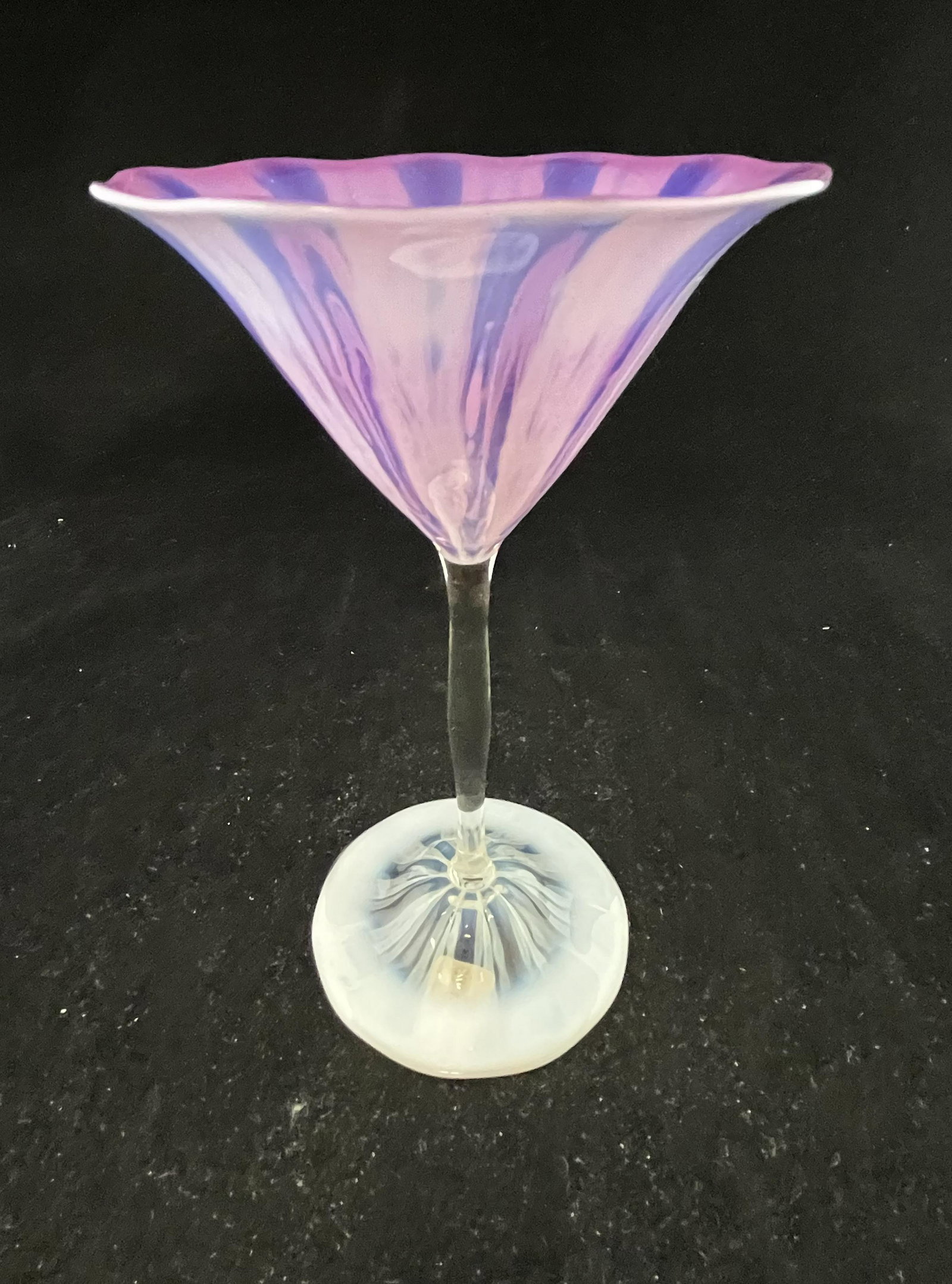 Tiffany purple Pastel wine: Tiffany Pastel opalescent purple footed wine goblet, signed L. C. T. Favrile, 7 1/2" ht. CONDITION: Good with no defects found.