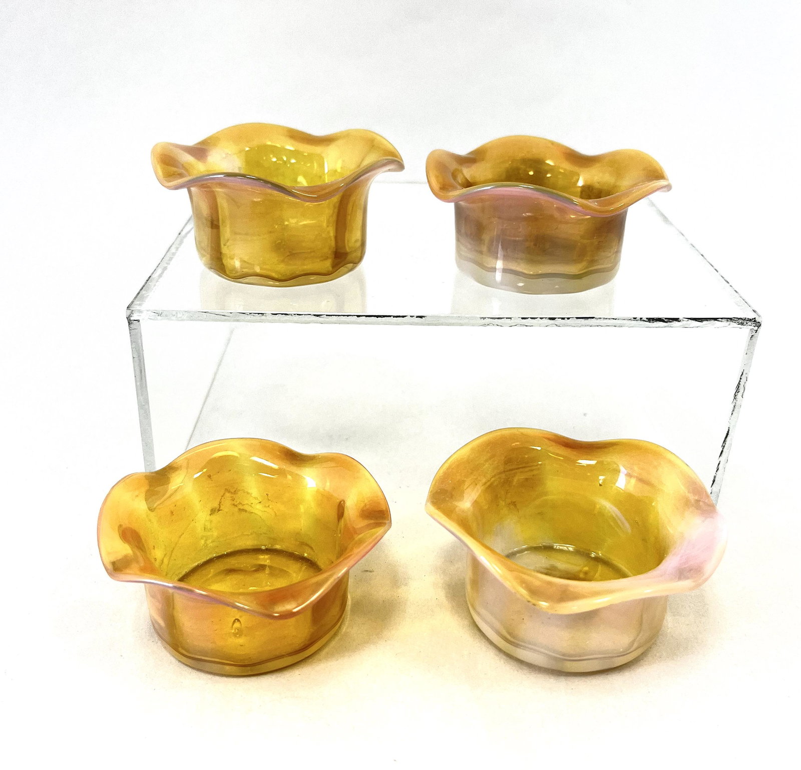 Four Monet and Stump salts: Four pink opalescent Monet and Stump open salts, 2 1/2" wide. CONDITION: Good with no defects found