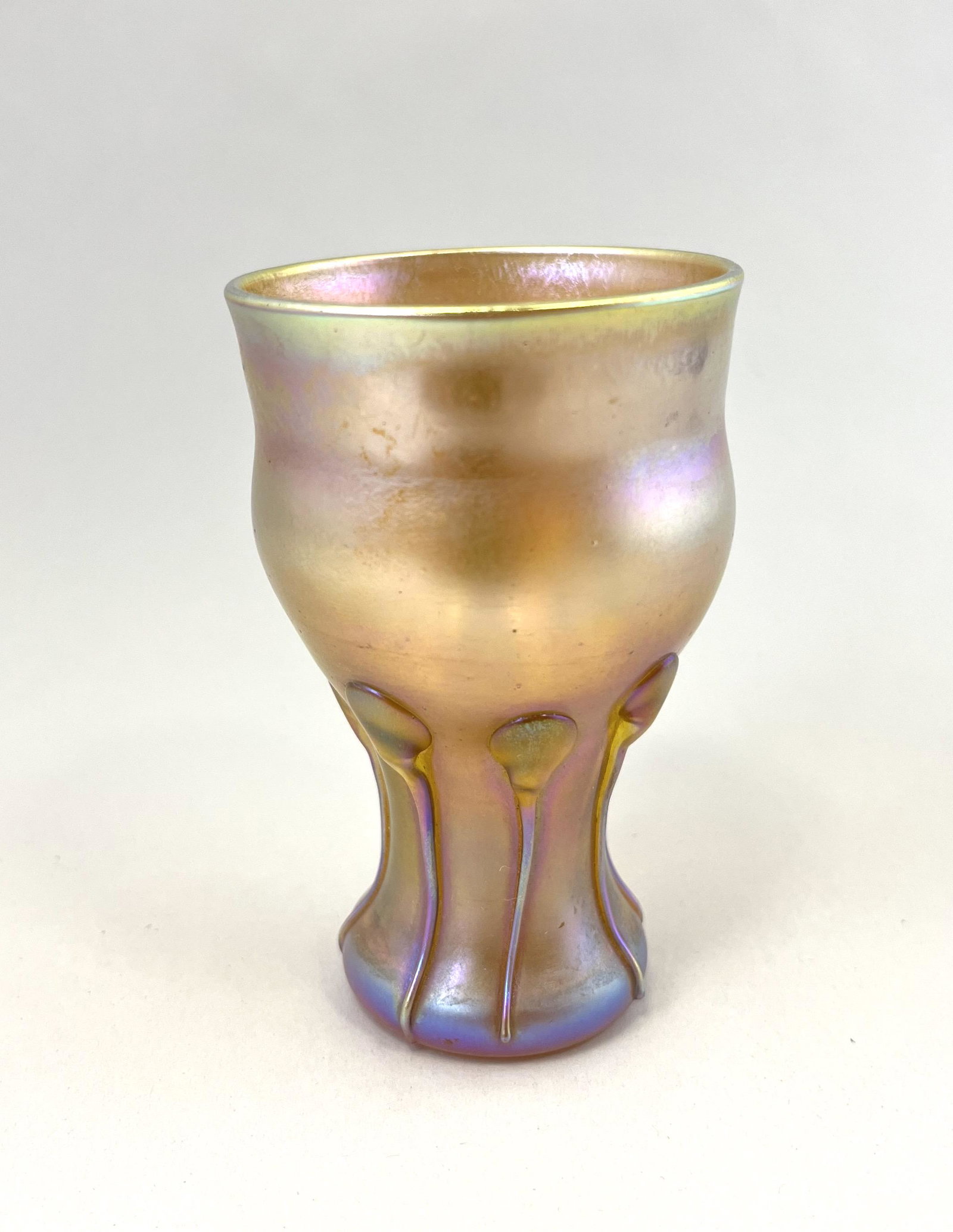 Tiffany Gold Favrile tumbler: Tiffany Gold Favrile corset form tumbler with eight side tear drops, signed LCT D2366, 3 1/2" ht. CONDITION: good with no defects found