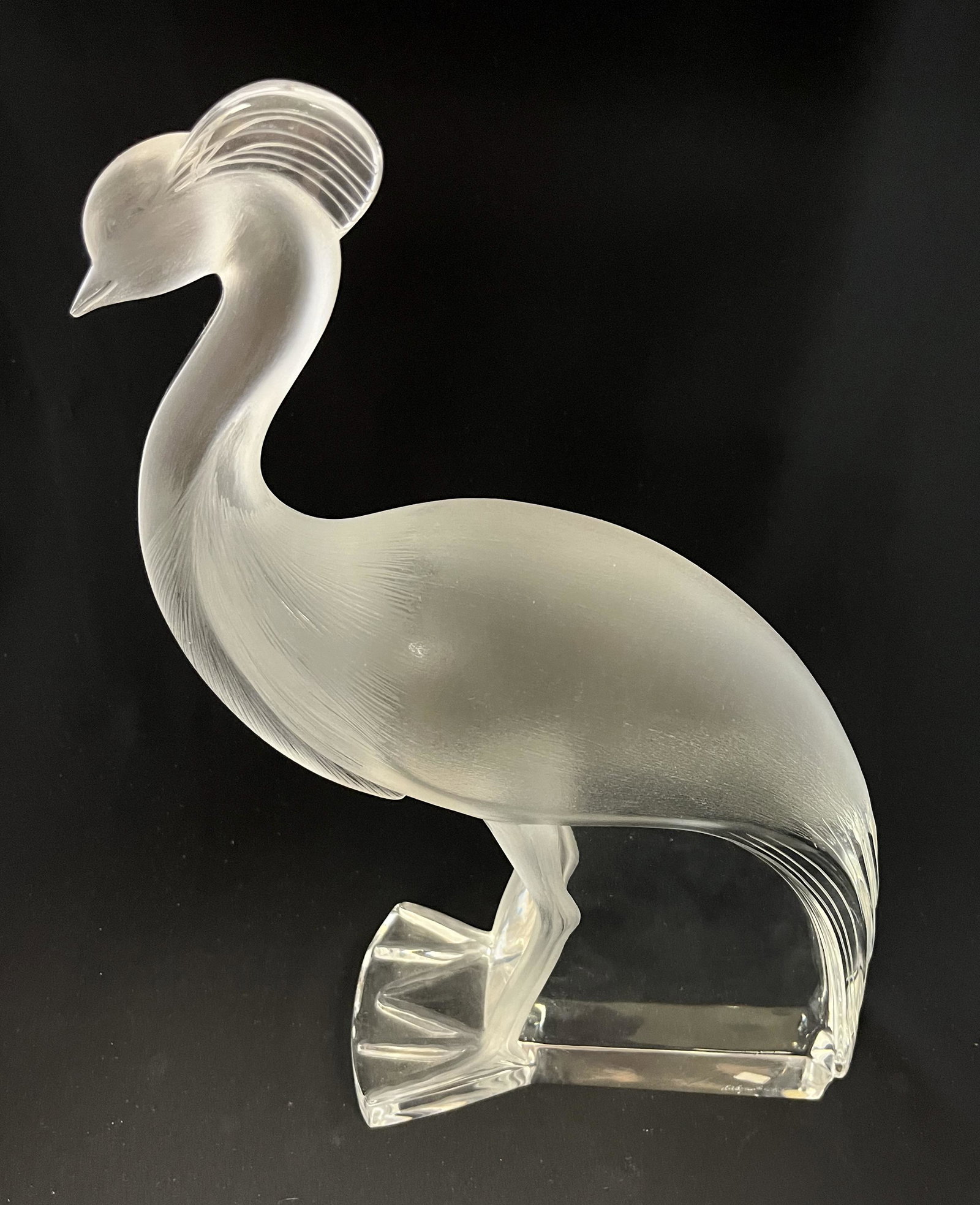 Lalique glass standing crane: Lalique frosted standing glass crane, signed Lalique France, 14" ht. CONDITION: no chips, cracks, repairs or material defects found. Jaremos attempts to call any material flaw that affects the price, 