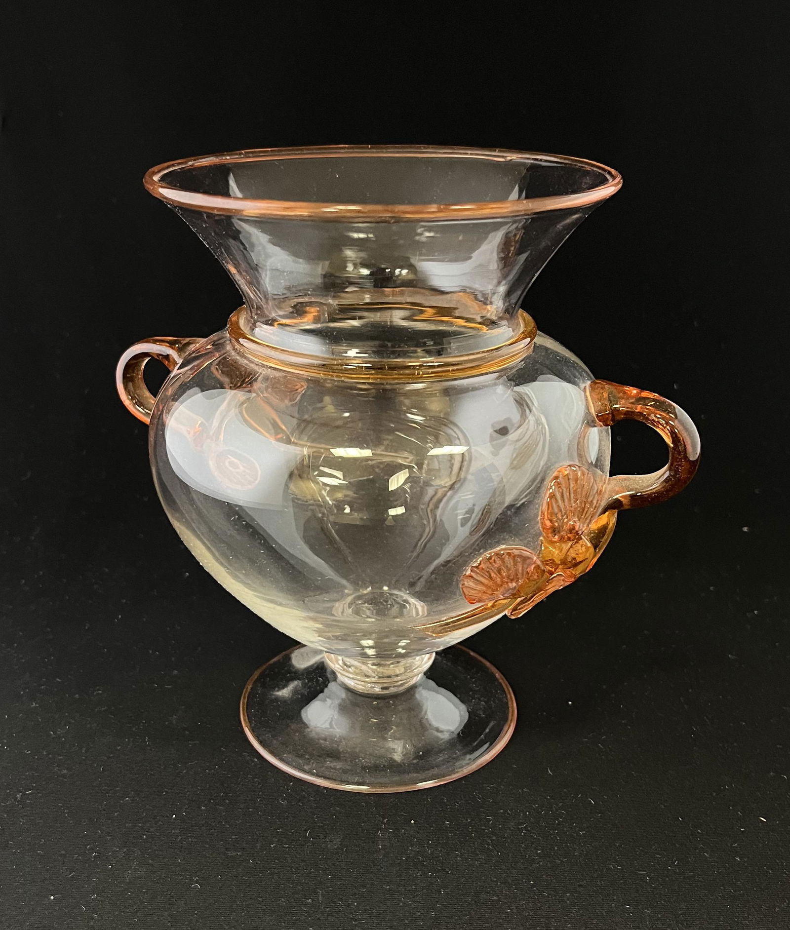 Steuben peach clear two handle footed vase: Steuben peach clear two handle footed vase with applied Mat-su-no-kee handles; 6" ht. CONDITION: minor loss to one end of applied decoration. Jaremos attempts to call any material flaw that affects th