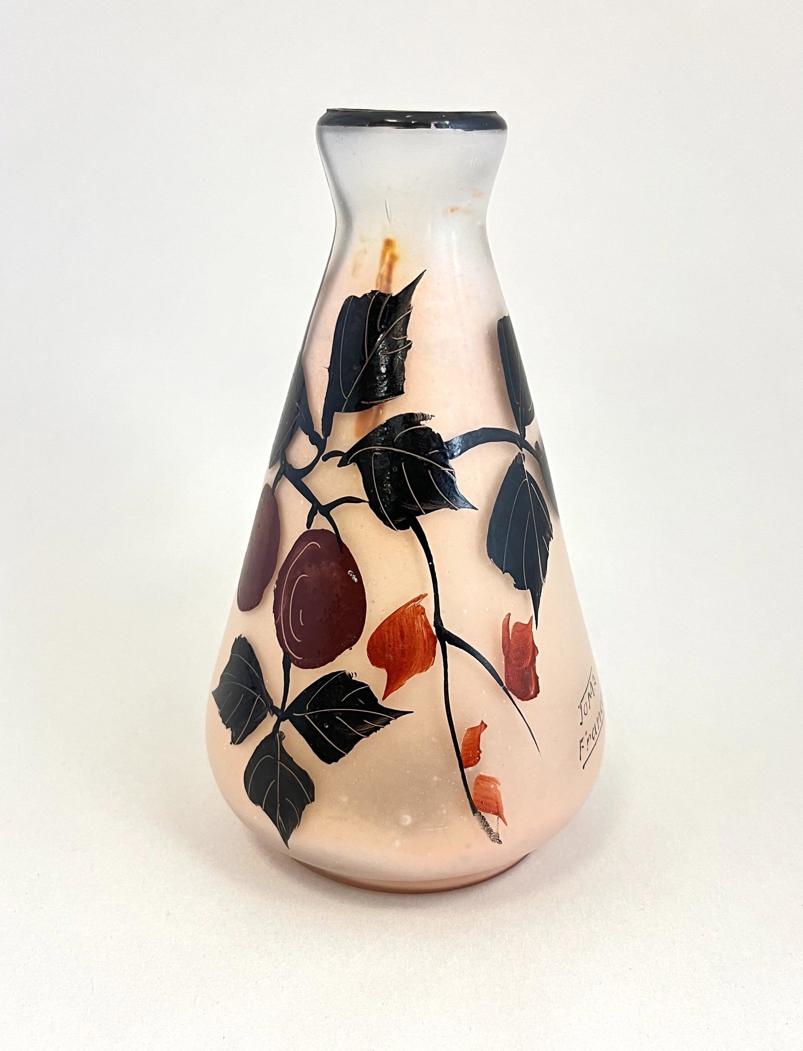 Joma France cameo glass vase: Joma France cameo glass vase with enameled cascading branch of plums, circa 1930, signed Joma France; 5 1/2" ht. CONDITION: Internal enamel ware, see picture. Jaremos attempts to call any material fla
