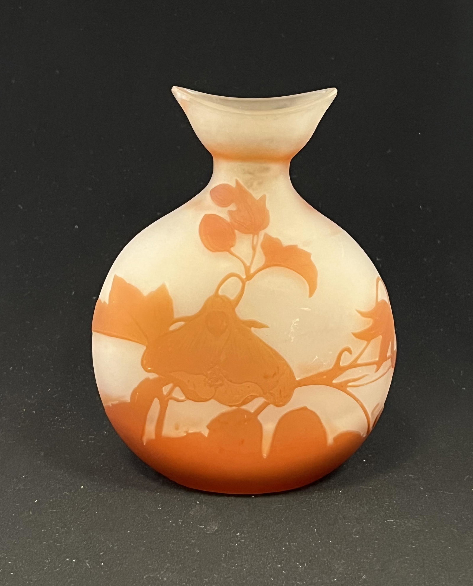 Galle French cameo glass vase: Galle pillow form vase with a bird beak rim in frosted glass decorated with orange branches and flowers and leaves, signed in cameo Galle, 6" ht. CONDITION: no chips, cracks, repairs or material defec